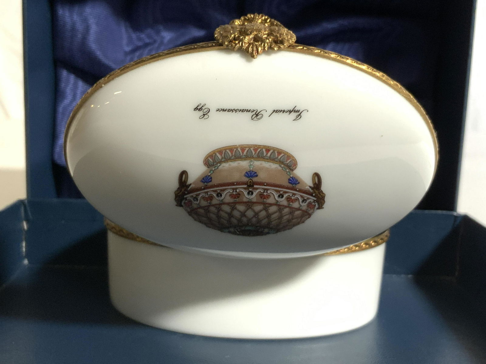 LIMOGES FABERGE RENAISSANCE EGG Trinket Box In Box: Underside of piece is marked FABERGE LIMOGES FRANCE. Lid reads IMPERIAL RENAISSANCE EGG. Trinket box is porcelain. Piece includes FABERGE box and card with information about piece. Trinket box measure