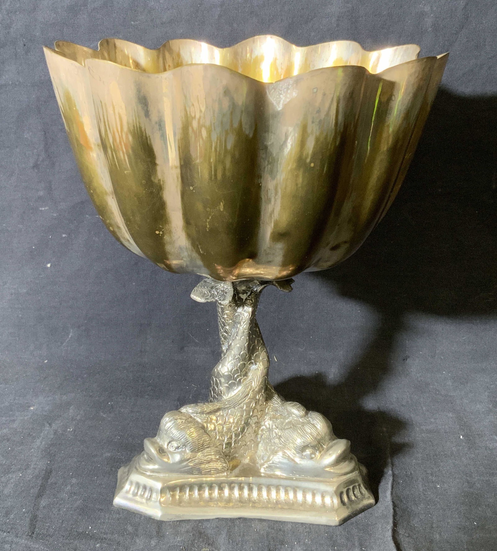 Dolphin Footed Silver Plated Pedestal Bowl: Dolphin footed silver plated pedestal bowl, base possibly silver plated, bowl itself made of a silver toned metal with what appears to be a gold wash, measures 10.25 inches tall and 8.5 inches in diam
