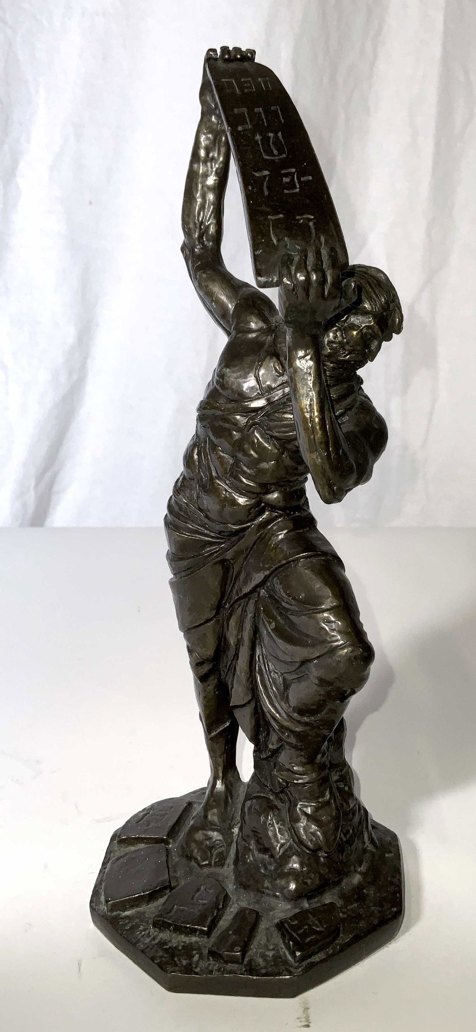 Signed YIANNIS KOUTSIS Bronze Moses Sculpture: Signed bronze sculpture, originally sculpted by YIANNIS KOUTSIS, signed on base, numbered 920. Depicts Moses angrily shattering tablets. Measures approx 10.5 inches H, and 4 inches in diameter. Wear i