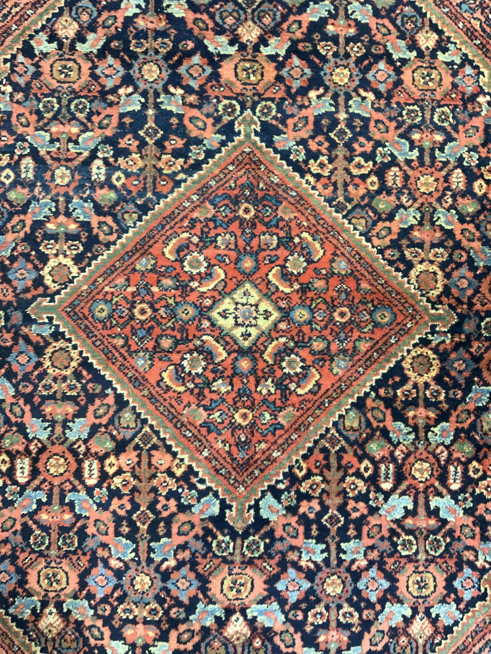 Vintage Handmade Persian Wool Rug: Rug is vintage possibly antique. Piece has intricate multi toned floral leaf & geometric detail. Rug has very short fringes. Piece is wool and handmade. Rug, carpet, vintage rug, area rug, wool rug, t