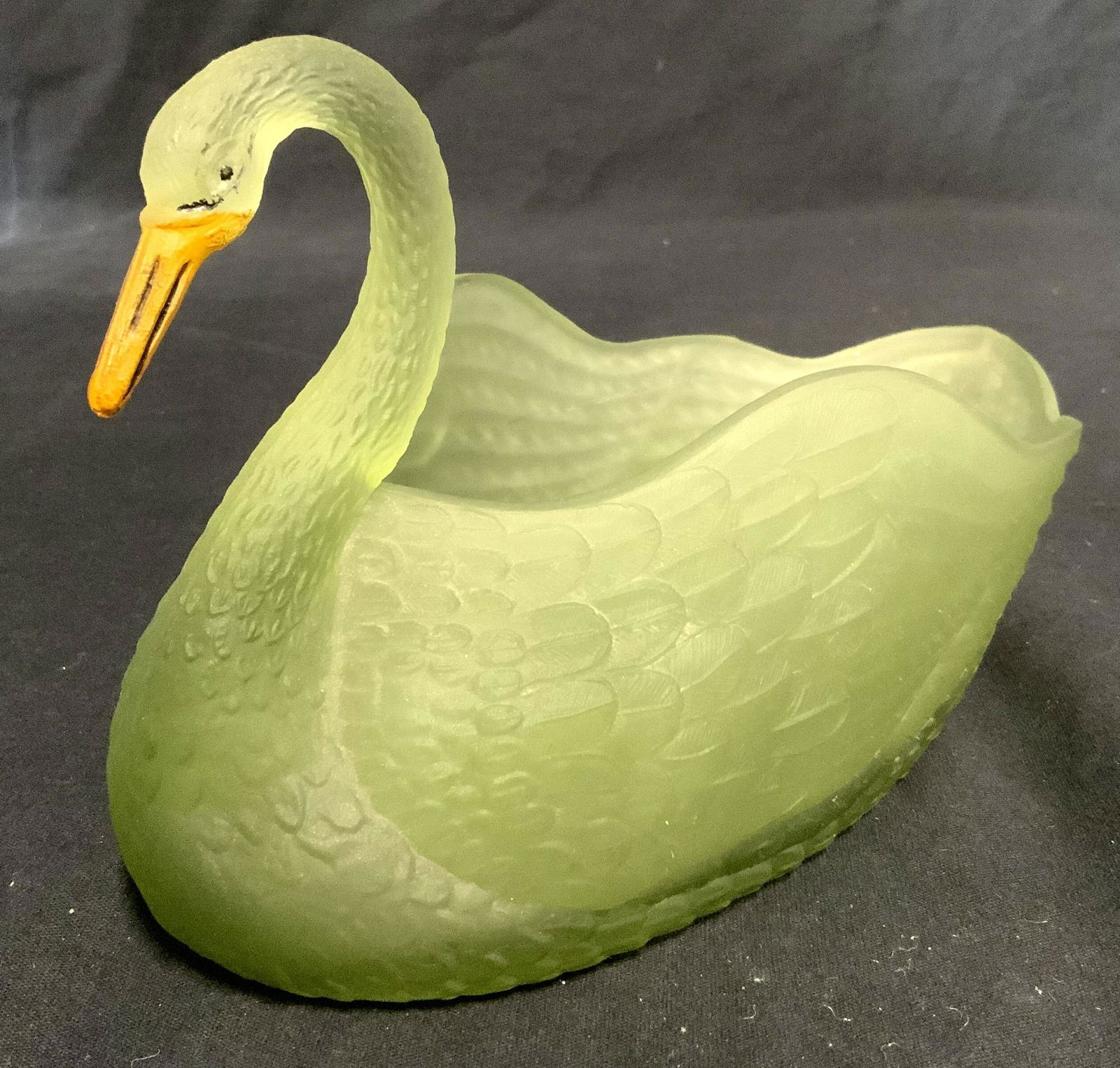 Vintage Frosted Glass Swan Vessel: Hand painted frosted glass, swan vessel. Beak and eyes are hand painted. An additional pierced glass item sits in the swan, possibly a candle or incense holder. Measures approx 5 inches H, and 9 inche