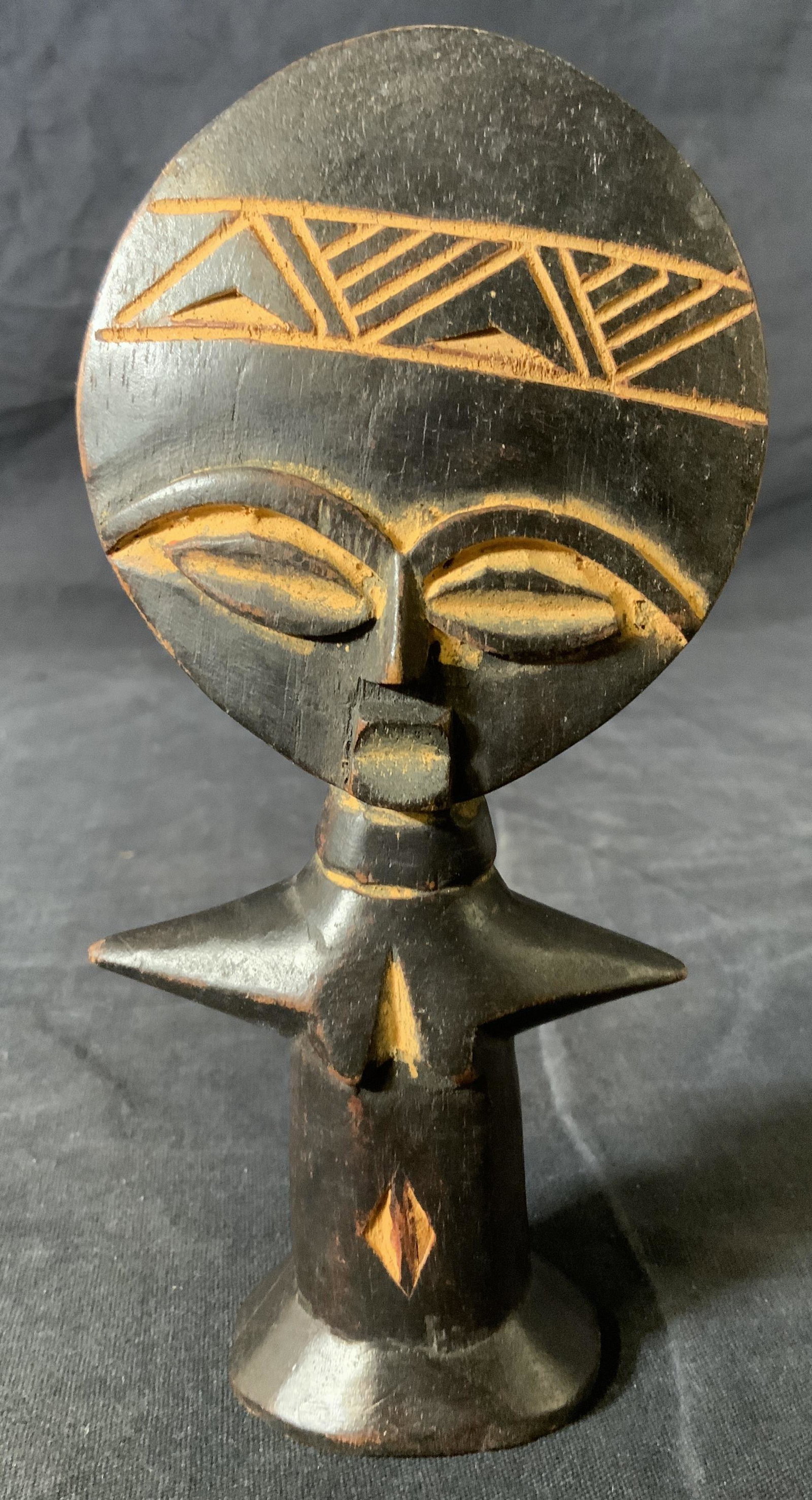 Ghanaian Fertility Figure Sculpture: Ghanaian Fertility Figure Sculpture, label to piece reads ‘Made in Ghana’, subject a figure with outstretched arms, measures 6 1/2 x 3 inches at widest point, some surface wear but overall in good