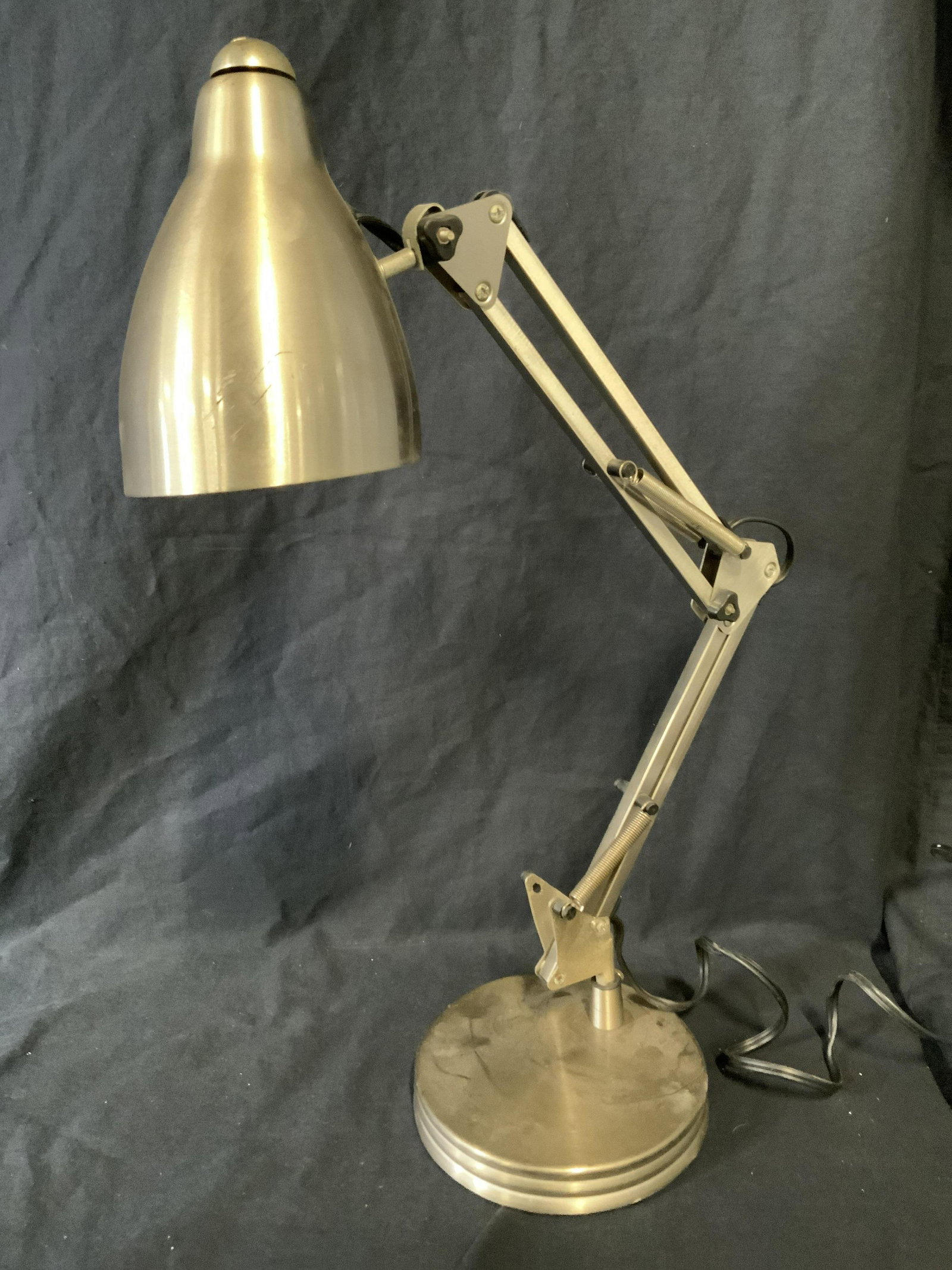 Brushed Metal Task Lamp: Brushed metal task lamp. Arm can be manipulated, a spring is absent. Measures approx 21.5 inches H, and 15 inches W. Wear is consistent with age and use. Lights, lamps, home lighting, decorative arts,