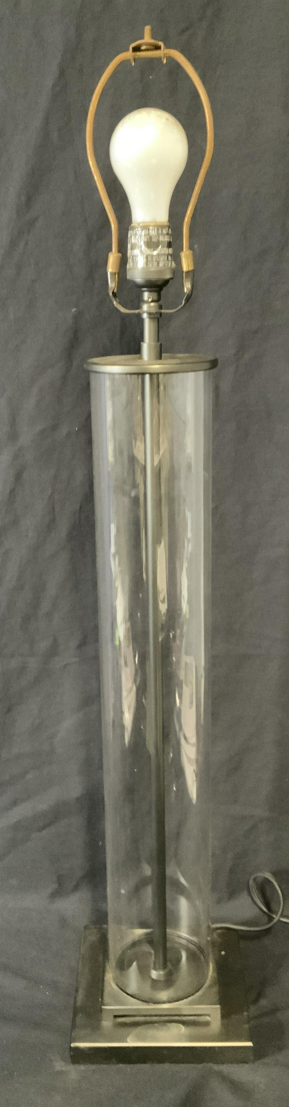 Vintage Glass & Metal Tabletop Lamp: Glass lamp, body is a tube of glass, base is metal. Finial is absent. Measures approx 34 inches H, and 6.5 inches W. Wear is consistent with age and use. Lights, lamps, home lighting, decorative arts,
