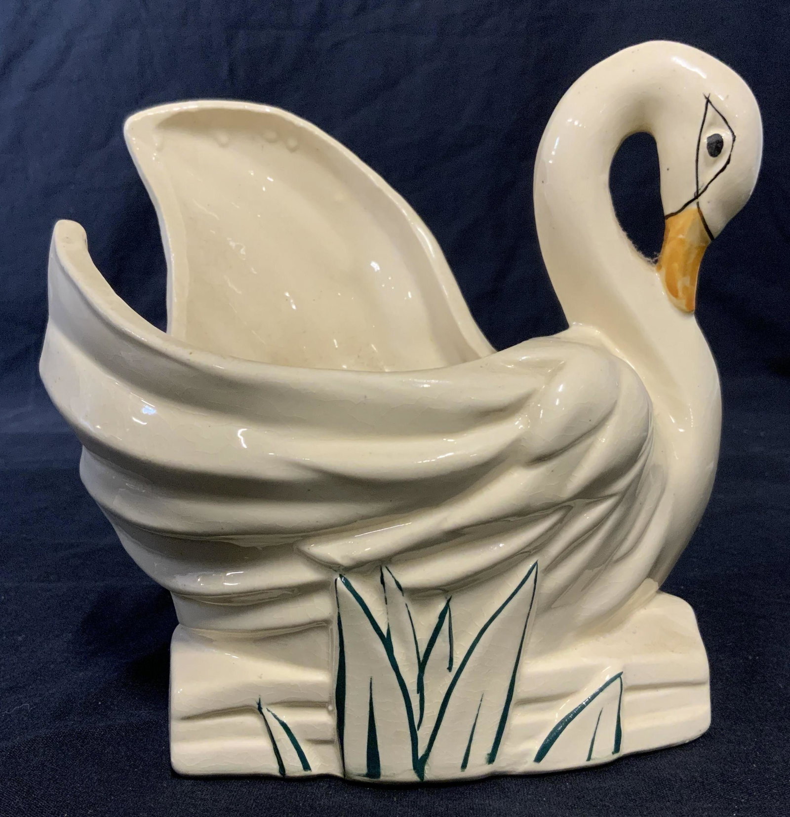Signed MC COY Ceramic Swan Vessel: Hand painted ceramic swan vessel, vessel is glazed. Beak, eyes, and plants are hand painted. MCCOY is cast into the underside of the base. Measures approx 6.5 inches H, and 6 inches W. Wear is consist