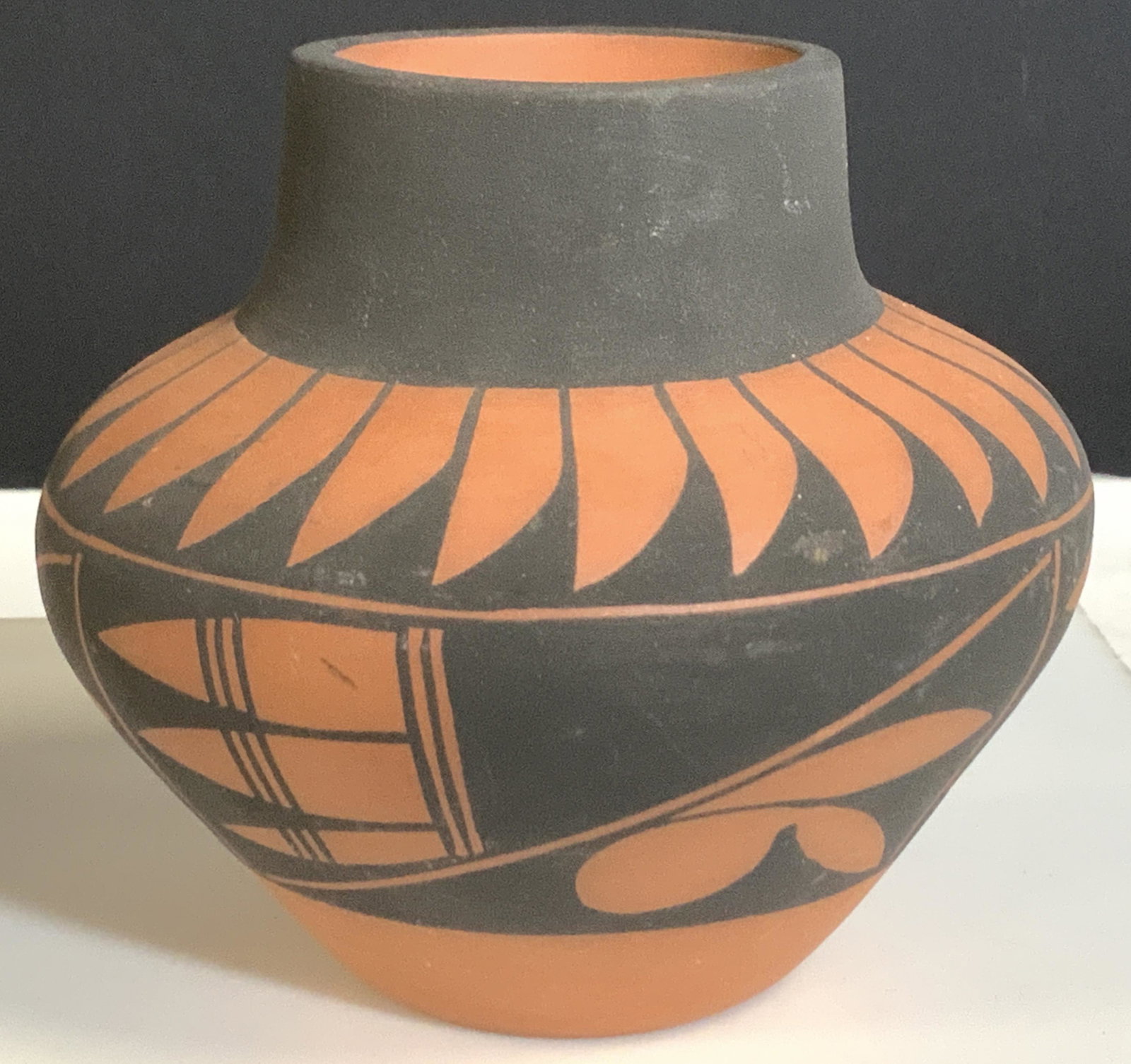 SIGNED ATIVE AMERICAN TERRA COTTA Vase: Handmade pottery from New Mexico. Decorative vase, vessel that is handmade with artist’s name on verso, signed D. TRUJILLO N. M. Pottery depicts NATIVE AMERICAN tribal patterns, Terra Cotta red and 