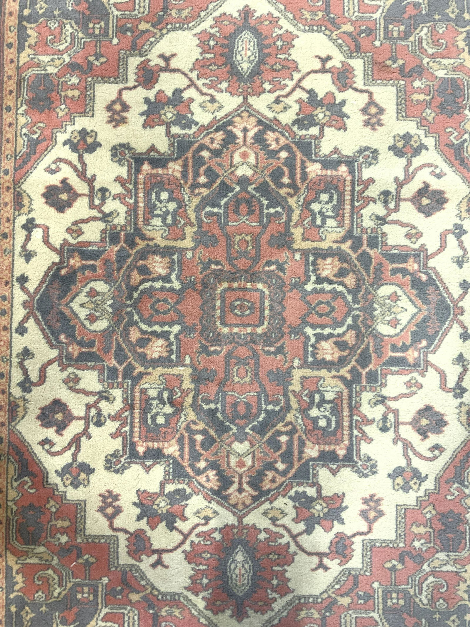 KARASTAN Vintage Fringed Wool Rug: Underside of rug has tag which reads KARASTAN. Piece has knotted fringes. Rug measures approx 71 inches long 49 inches wide. Rug, carpet, area rug, wool rug, KARASTAN rug, fringed rug. home furnishing