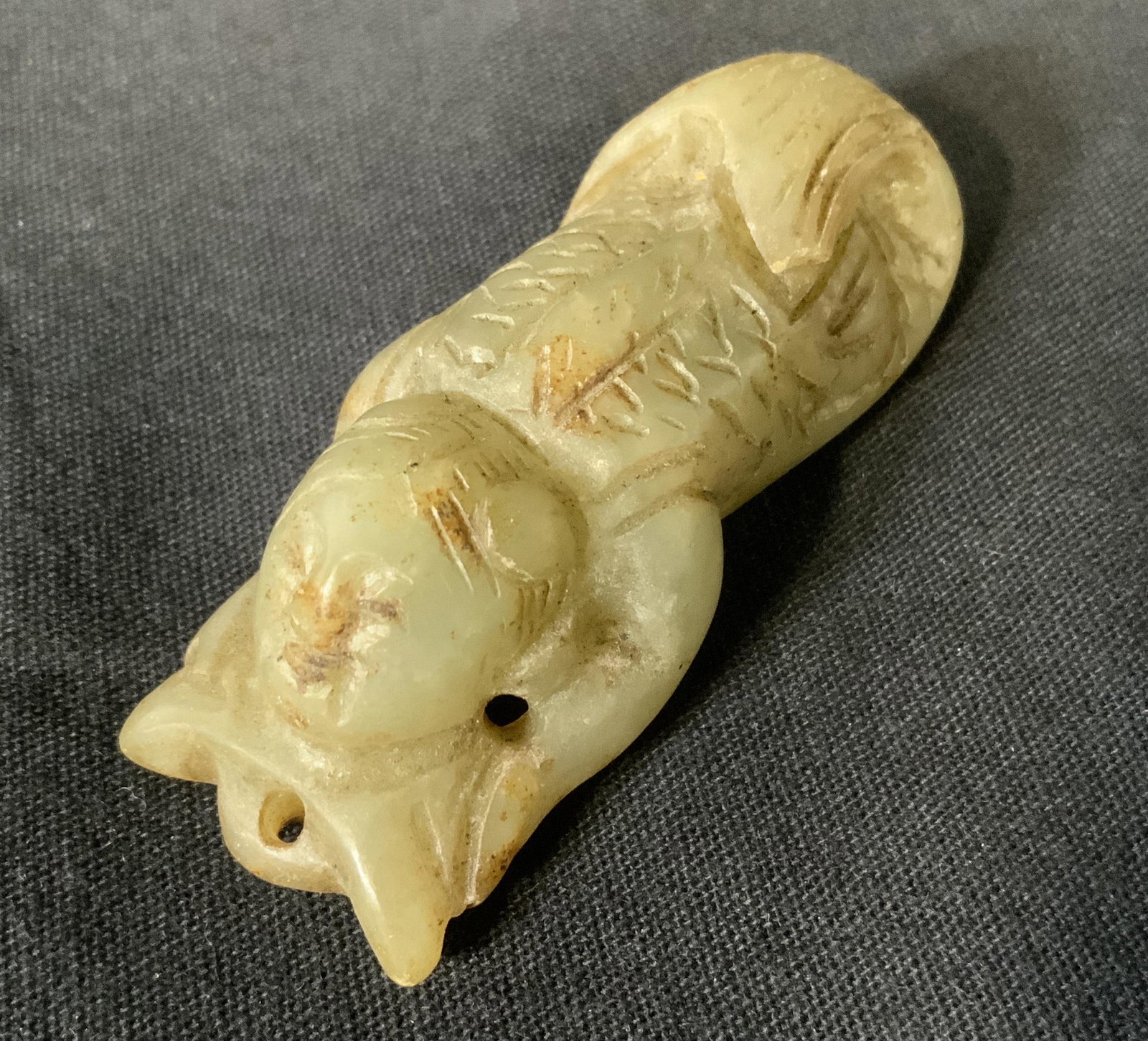 Chinese Jadeite Mermaid Bead: Chinese Jadeite Mermaid Bead, no apparent inscriptions or marks, tested positive for Jadeite on Presidium gem tester, a mermaid holding an ingot, measures 2 1/2 x 1 inch wide, some surface wear but ov