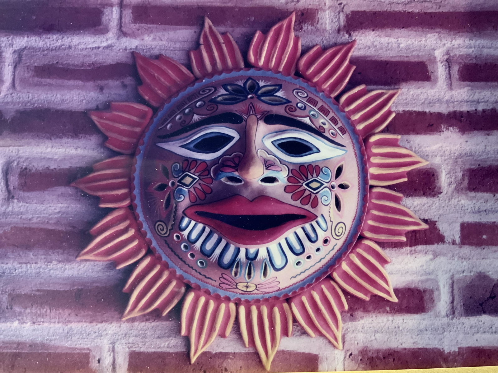 Framed Photographs of a Mask, Artwork: Framed Photographs of a Mask, no apparent inscriptions or signatures, subject a sun mask, measures 12 3/4 x 23 1/4 inches, wooden frame, some minor scratches to frame but overall in good condition, pr