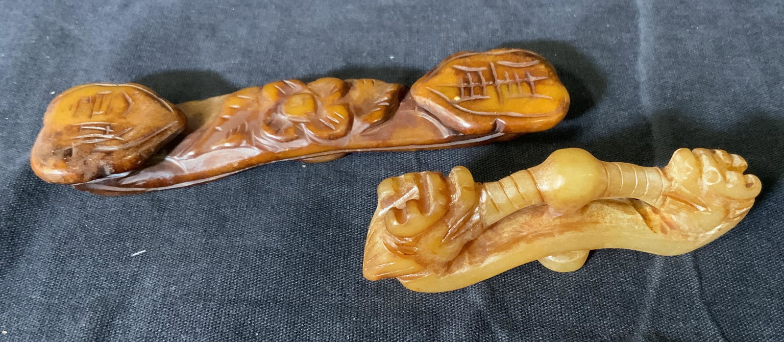 Lot 2 Chinese Jadeite Belt Hooks: Lot 2 Chinese Jadeite Belt Hooks, tested positive for Jadeite on Presidium gem tester, longer hook measures 4 1/2 inches long, lion hook measures 3 inches long, some chips to stone but overall in good