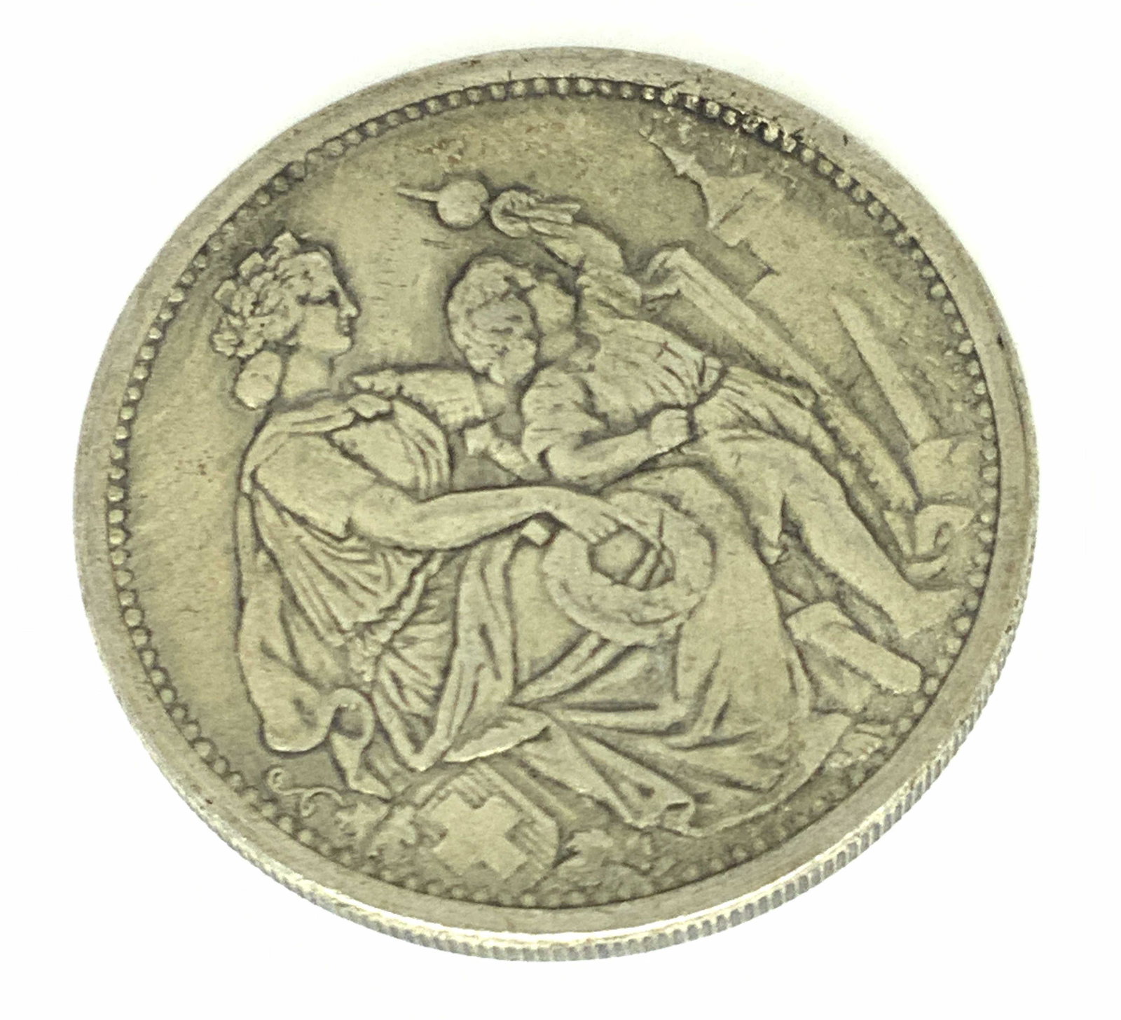 Antique Collectible Swiss Currency, 1865 5 Francs: A silver five franc coin. Swiss currency, Shooting Thaler. Antique, 1865. Obverse reads EIDGENÖSSISCHES SCHÜTZENFEST IN SCHAFFHAUSEN. Reverse depicts a seated figure with a child. Commemorative issu