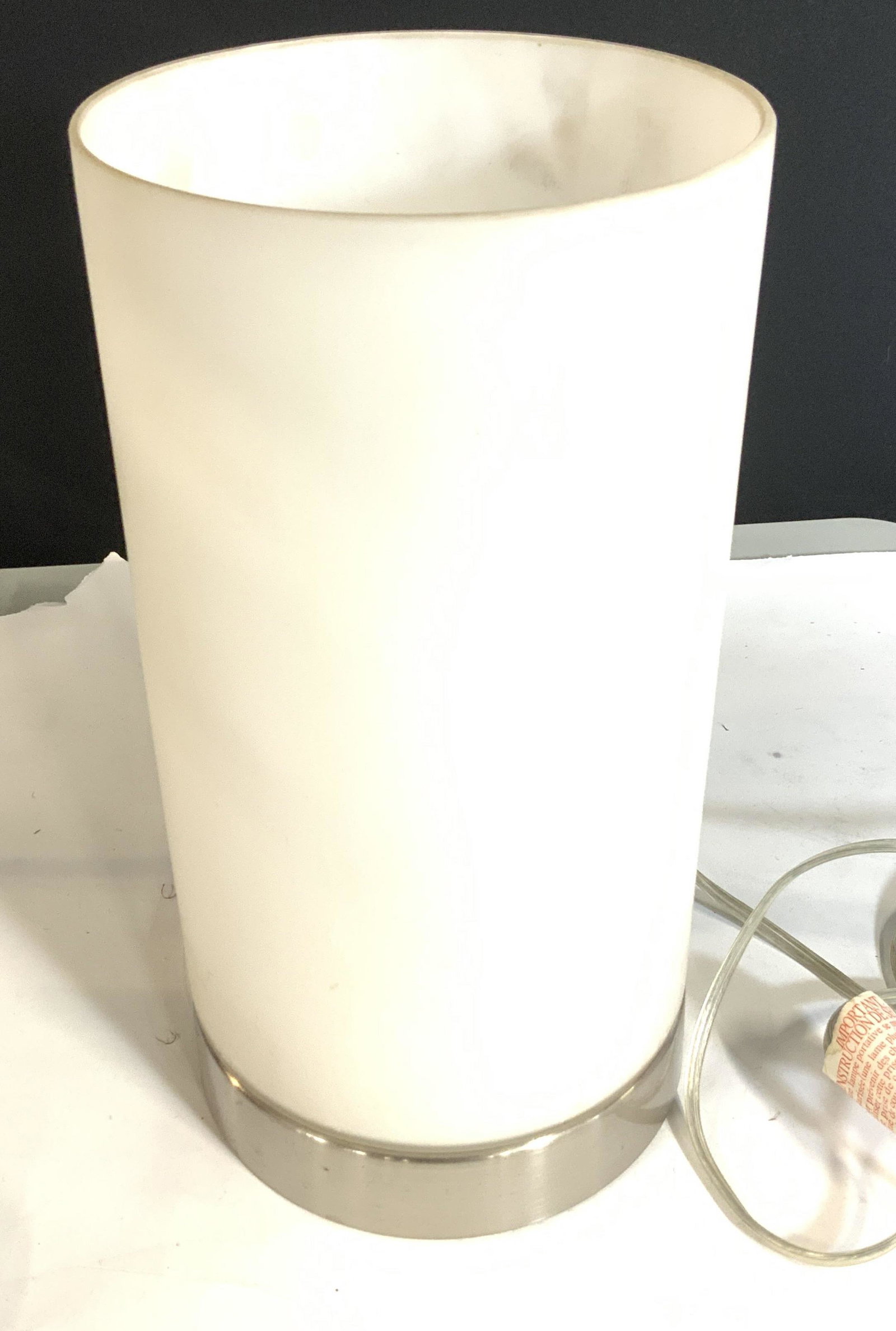 Mid Century Modern Cylinder Floor Light: Chrome, frosted white glass cylinder shade 17 in. Ht, app 7 in. diameter. A modern light with mid century flair. Sits on floor to shine upward. Button switch on cord. Lighting, mid century modern ligh