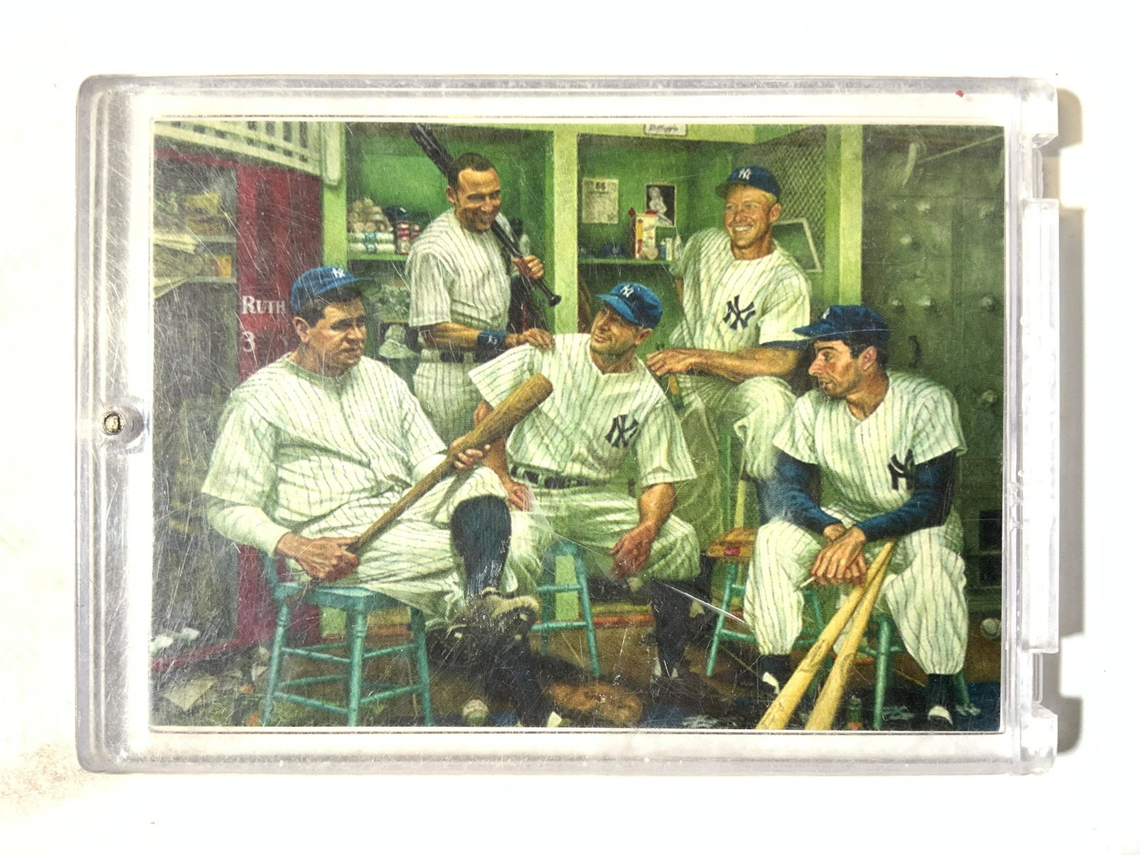 New York Yankee Greats Baseball Card: Front of Baseball card depicts image of Lou Gehrig, Derek Jeter, Babe Ruth, Mickey Mantle, & Joe DiMaggio. Backside of card has printed images of each players signature. Card is in plastic casing. Car