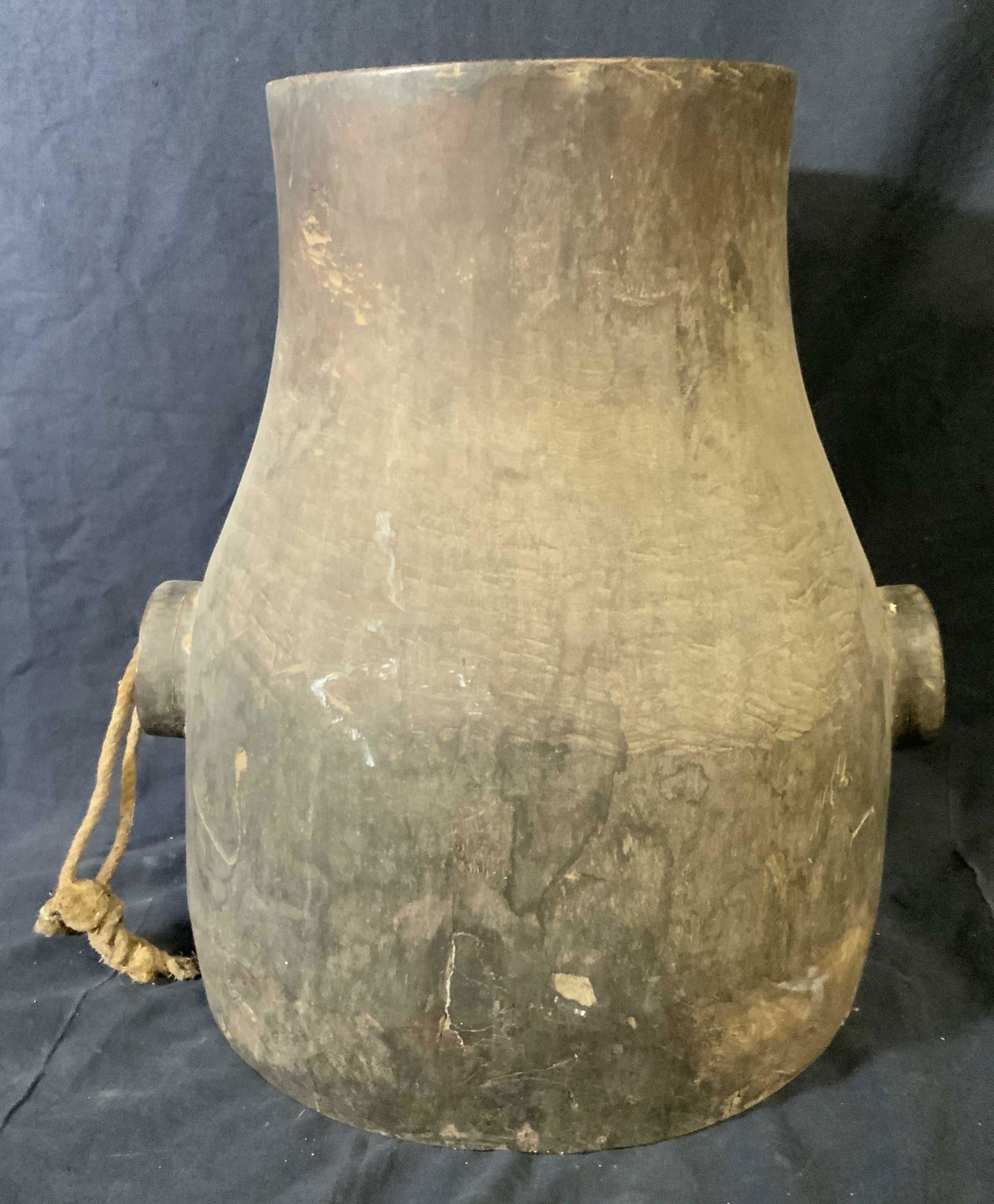 Wooden Pot Vessel, Decorative Object: Wooden Pot, has a handles to either side, one of the two handles has a loop of rope around it, piece measures 14.5 inches at tallest point, no apparent inscriptions or markings, some scuffs and scratc