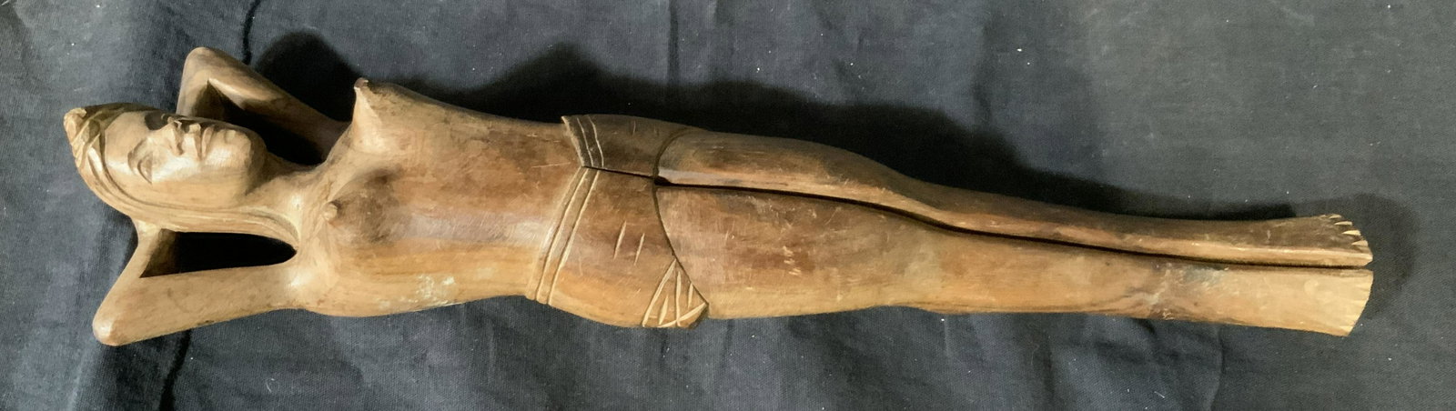 Wooden Female Figure Nutcracker: Wooden female figure nutcracker, no apparent inscriptions or markings, subject a reclining female nude sculpture with legs that open to crack a nut, piece measures 14 inches long, some scuffs to piece