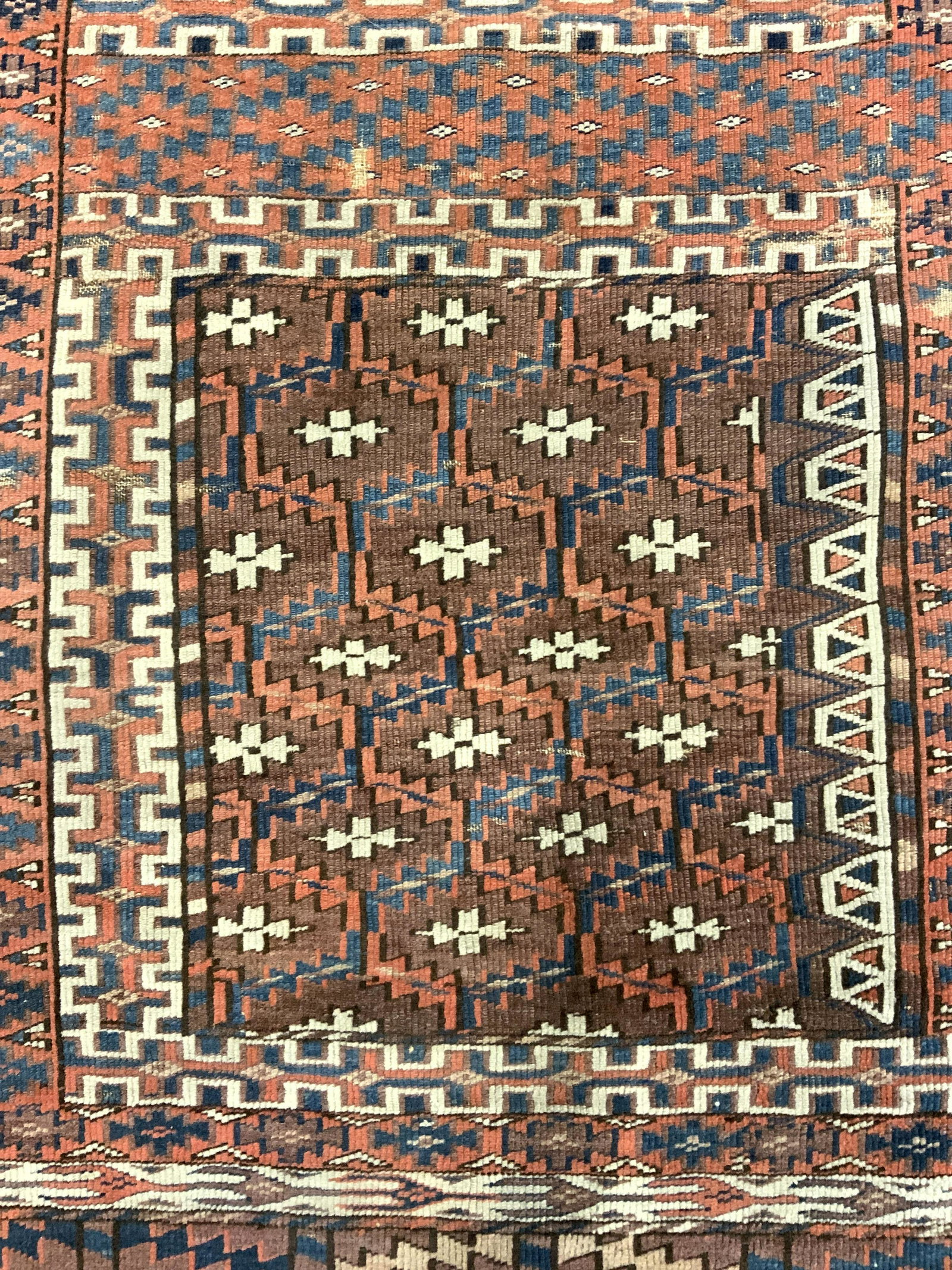 Antique Handmade Geometrically Detailed Wool Rug: Rug is wool and handmade. Piece is vintage possibly antique. Rug has intricate geometric detail. Rug measures approx 62 inches long 47 inches wide. Rug has small fringes. Rug, carpet, area rug, wool r