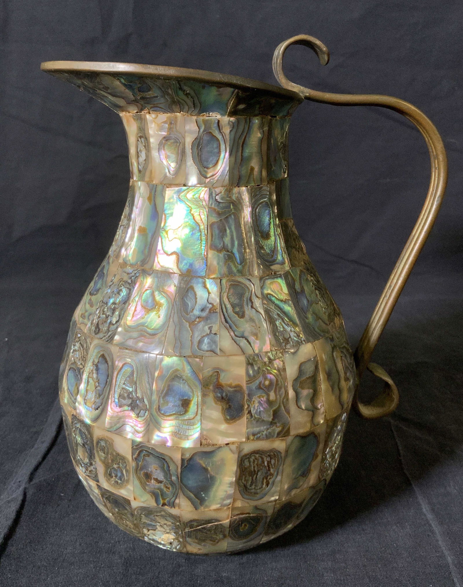 Vintage Pitcher with Abalone Shell Inlay, Mexico: Vintage Pitcher with Abalone Shell Inlay, Mexico, inscription to base reads ‘Hecho en Mexico’, measures 8 1/8 inches tall x 6 1/2 inches at widest point, some surface wear from use and loss of inl