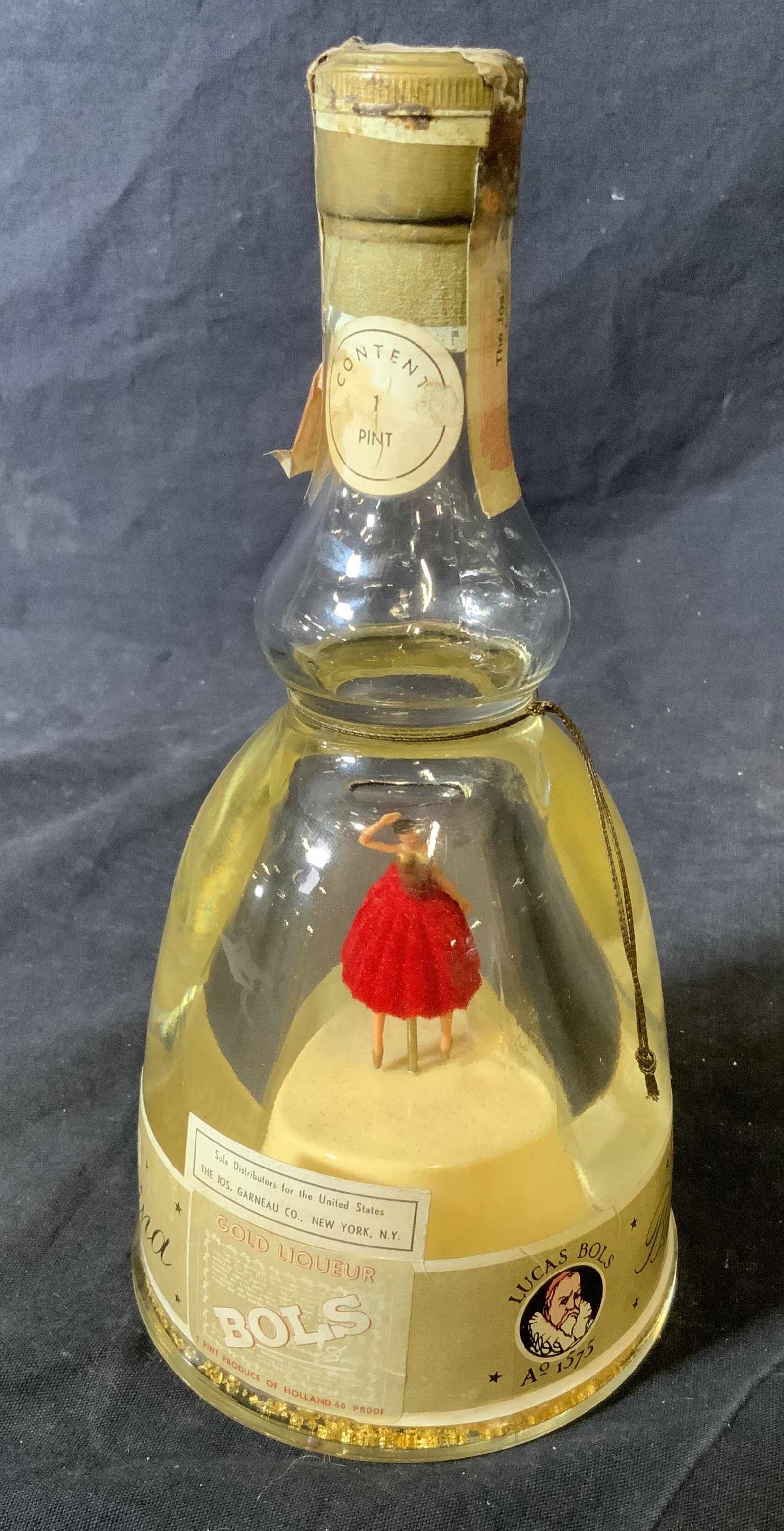 Bols Ballerina Gold Liquor Music Box Bottle: Bols Ballerina gold liquor music box bottle, bottle is unopened, bottle reads ‘Gold Liquor Bols, Lucas Bols AO 1575 Bols Ballerina’ and ‘Sole distributors for the United States The Jos. Garneau 