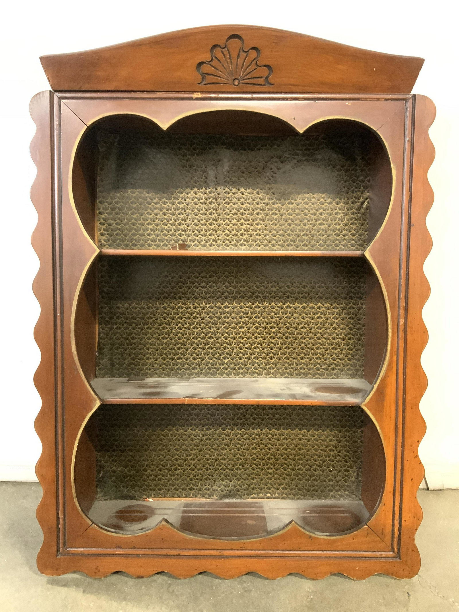 Antique Carved Wooden Spice Rack Display Shelf: Display shelf is vintage possibly antique. Piece has carved wooden relief detail to center of top. Piece has 2 wooden shelves. Shelf has waved sides and lower area. Piece measures approx 28 inches tal