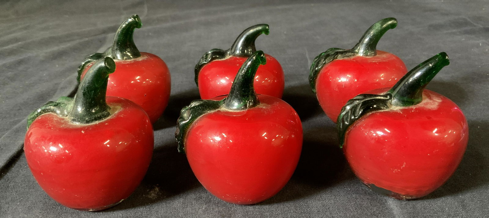 Set 6 Glass Apple Paperweights: Set 6 Glass Apple Paperweights, no apparent inscriptions or marks, all measure approximately 2 5/8 inches tall x 2 inches in diameter, some surface wear from use, chips to some pieces, Property of mul