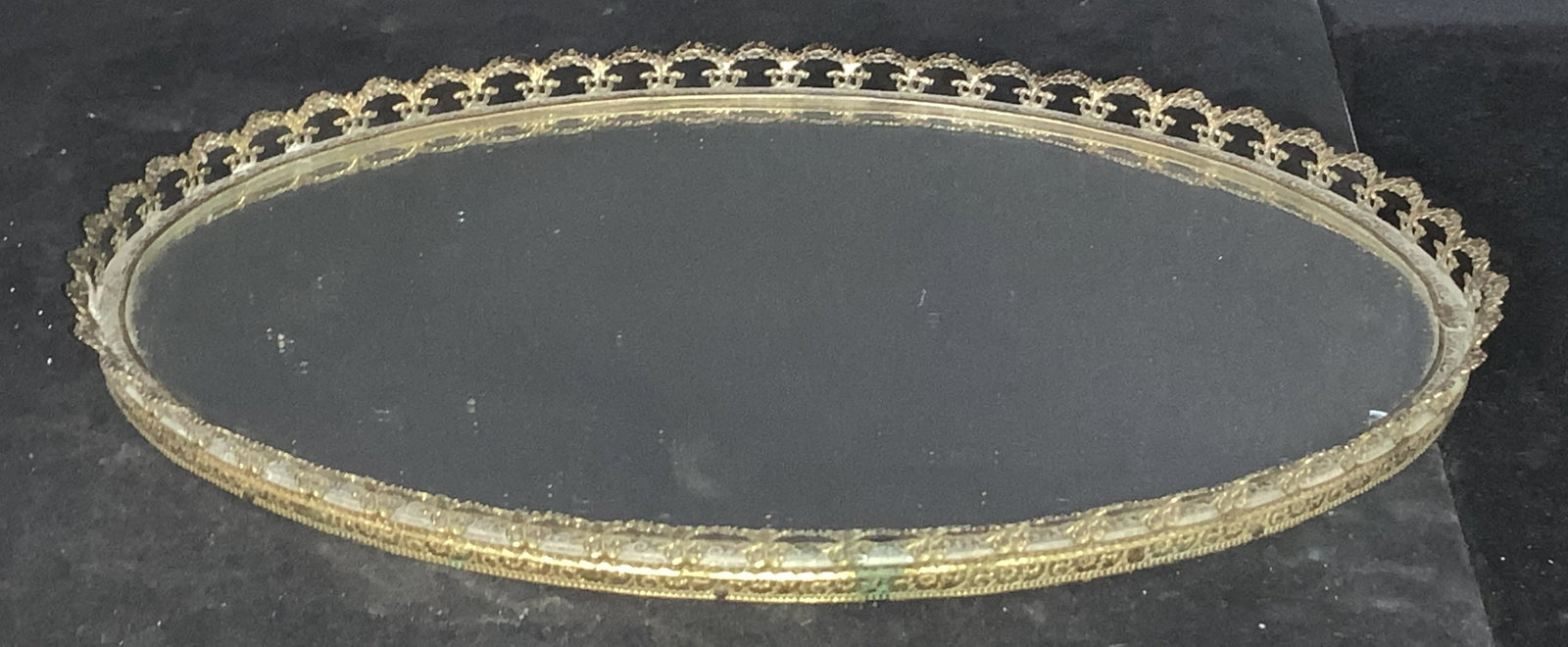 Victorian Pierced Brass Mirror Vanity Tray: Vintage mirror tray for dresser top, bathroom, table decor, more. Pierced brass metal rim with Victorian pattern. No surface issues with mirror. Felted underside. 12 x 8.5 in. Property of Multi Genera