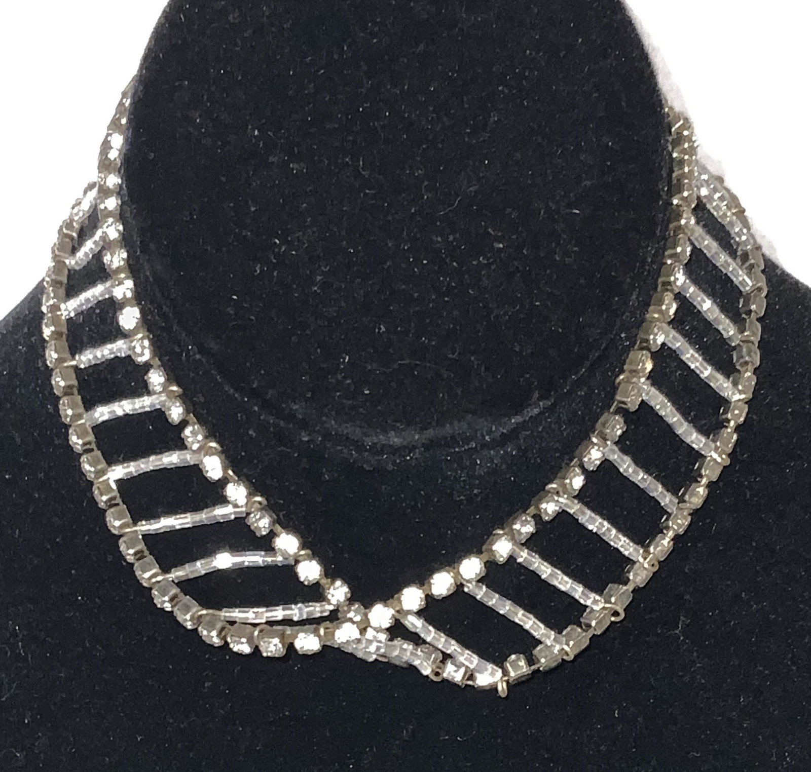 Vintage Bead & Rhinestone Deco Choker Necklace: Vintage 13 in necklace (at longest) laid out like railroad tracks. Center iridescent white seed beads with solitaire rhinestones in prongs. One line of rhinestones faces opposite when necklace sits on