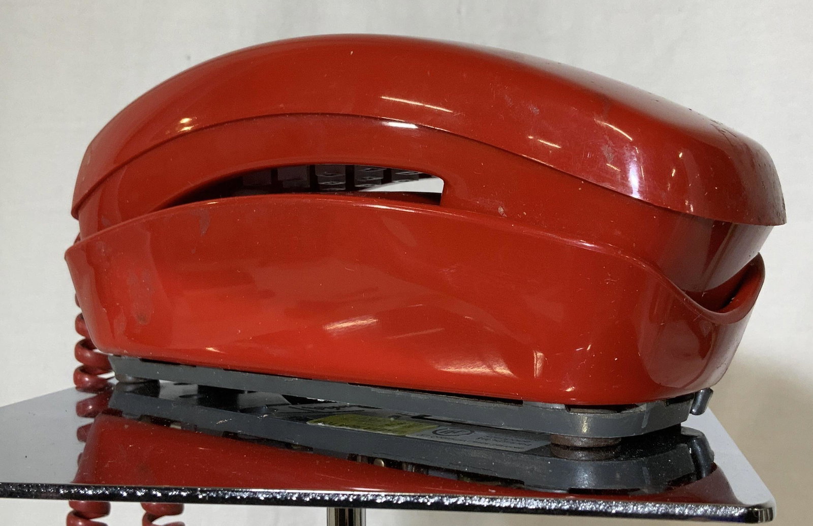 Vintage Red PRINCESS Telephone, Model 2223: TRIMLINE Princess Pushbutton Telephone, popular in the 1980s and early 1990s. Attaches to wall or tabletop. Has label reads Refurbished Telephone Equipment. Sticker also reads model 2223. Property of 
