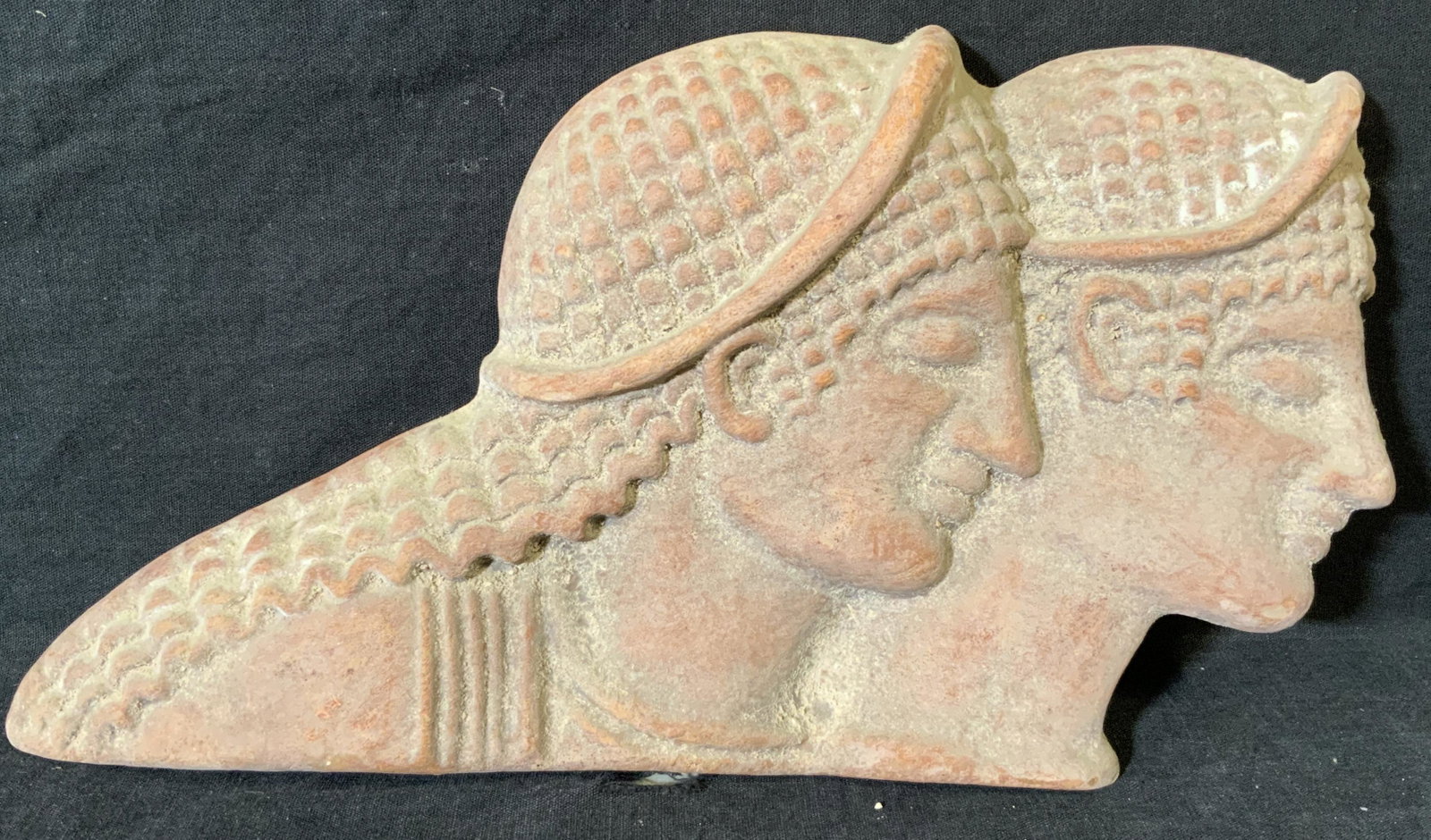 Byzantine Style Ceramic Relief plaque: Byzantine style ceramic relief, no apparent inscriptions or markings, subject heads of two humans facing off to the right with braided hair, ceramic piece colored a brown red, measures 7 inches tall b