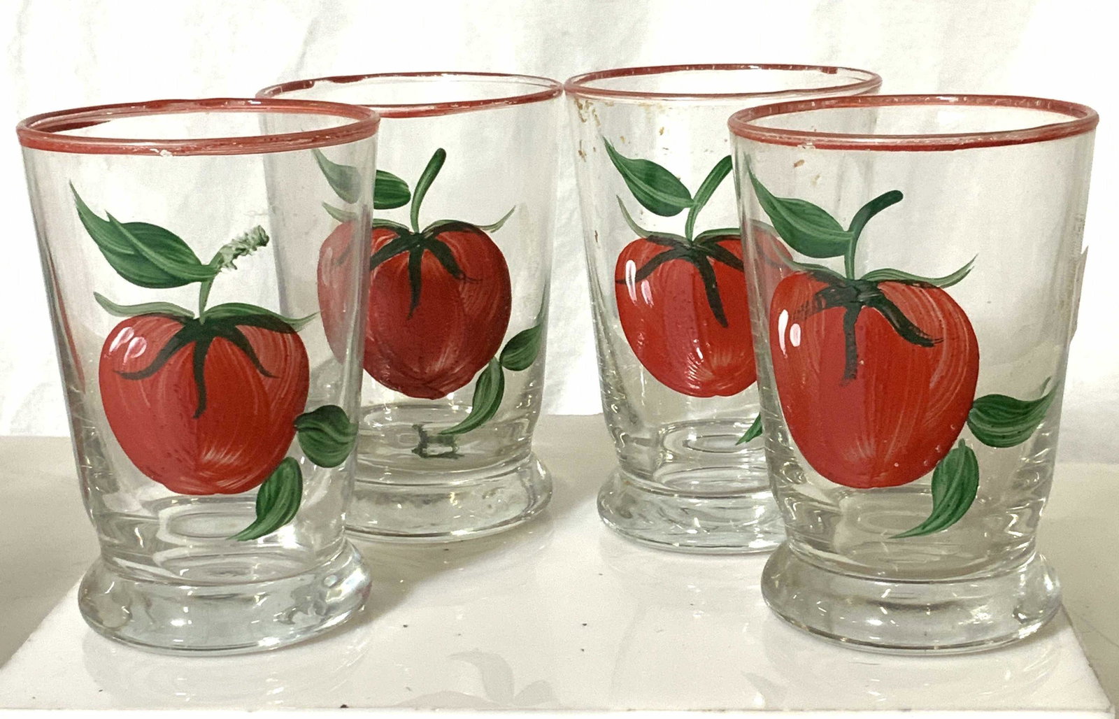 Set 4 Vintage Hand painted Juice Glasses: Vintage Juice glasses with hand painted tomato on glass. 4 in ht, 2.25 in diameter. Property of Multi Generation Brooklyn Collector’s Estate. Barista, kitchenware, vintage juice glasses, vintage tom