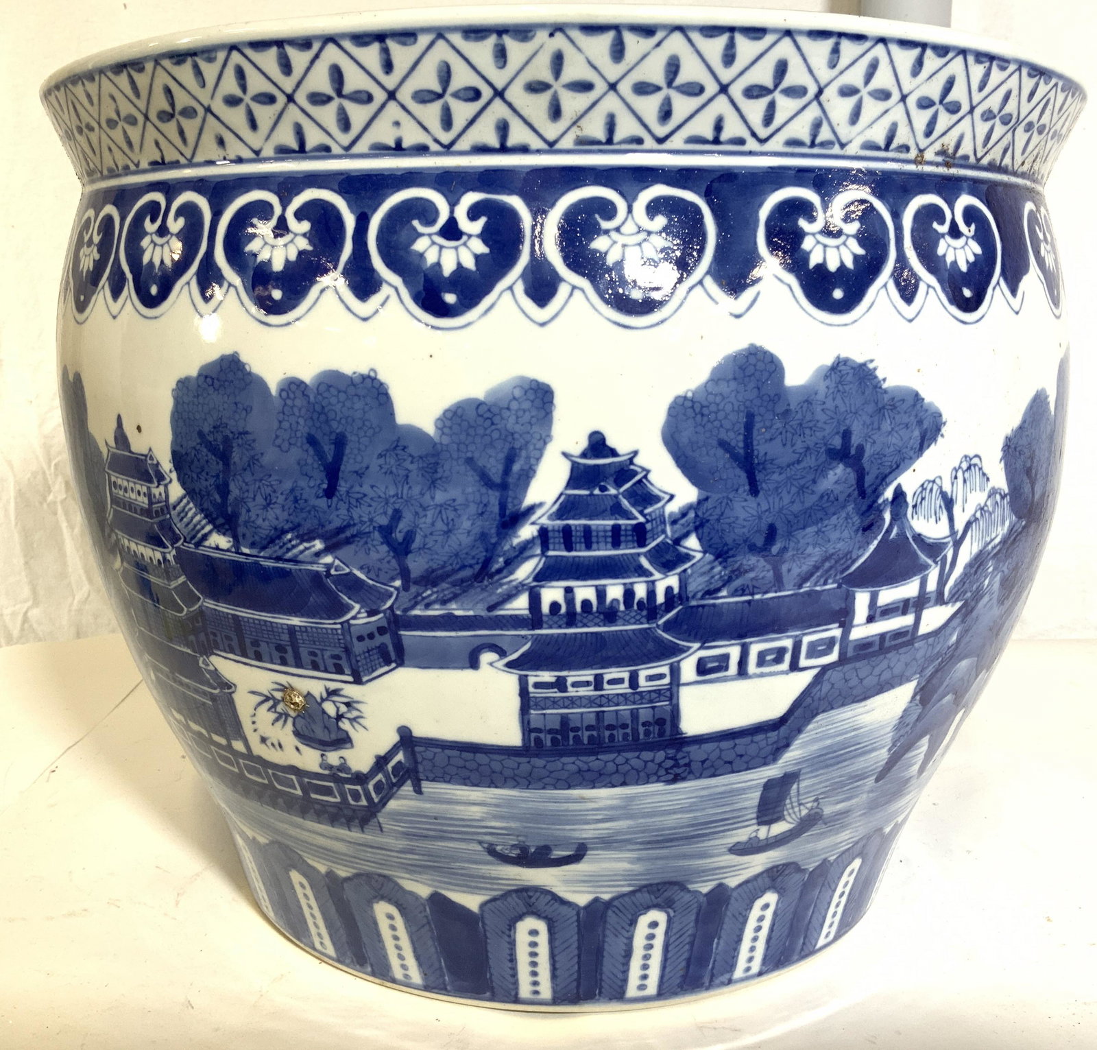 Vintage Asian Porcelain Planter Vessel: Planter is vintage. Piece appears to have some hand painted elements. Planter depicts image of a village with Asian architecture. Piece has geometric & floral pattern detail near & on rim. Planter, As