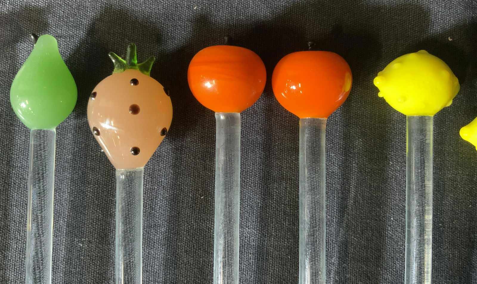 Lot 13 Fruit & Animal Glass Drink Stirrers: Lot 13 Fruit & Animal Glass Drink Stirrers, no apparent inscriptions or marks, shortest stirrer measures 6 5/8 inches long, longest stirrer measures 8 1/2 inches long, chips and surface wear to some p