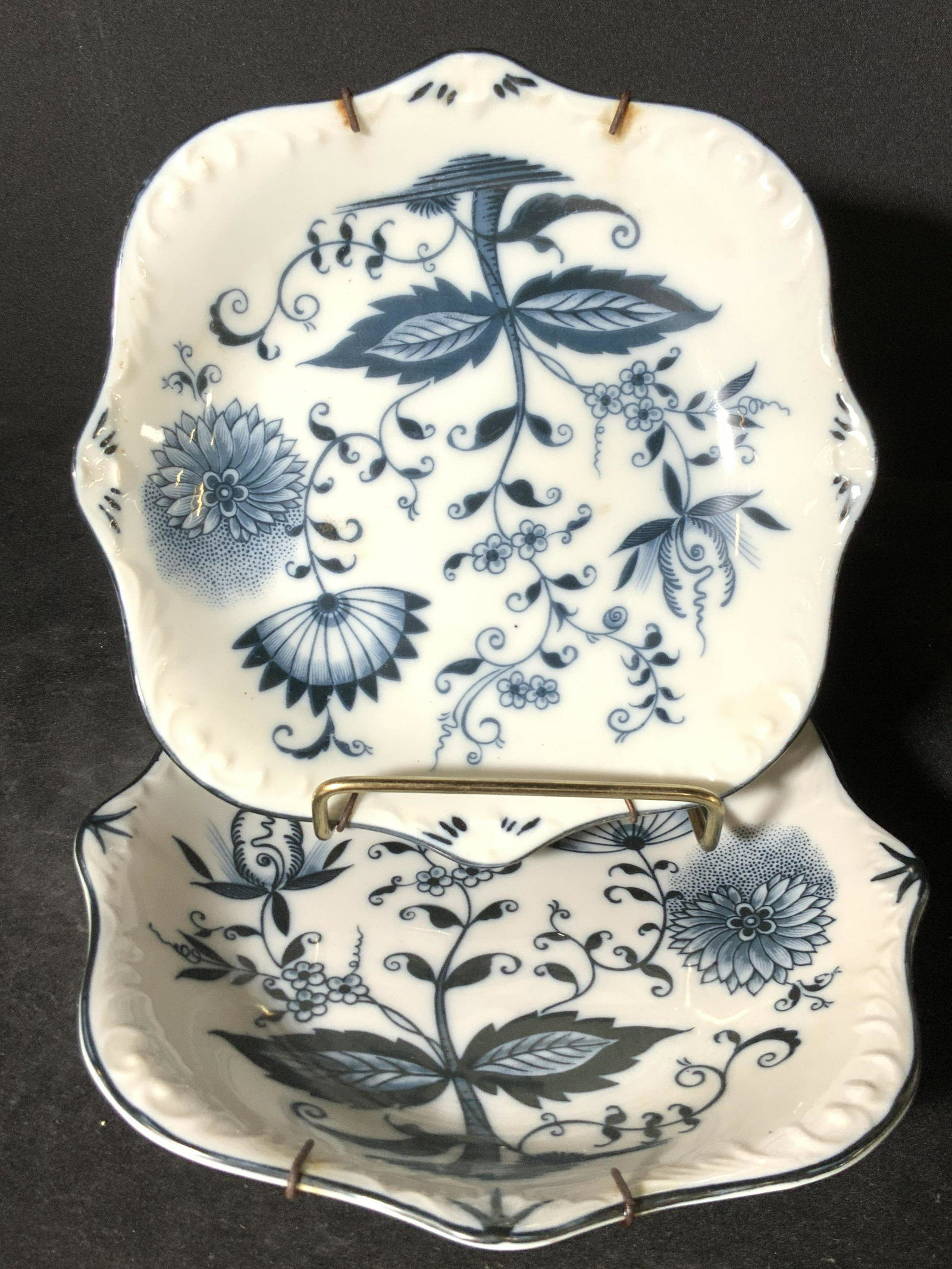 Pr MEISSEN Style BLUE ONION Hallmarked Porcelain Dishes: Pr MEISSEN Style BLUE ONION Hallmarked Porcelain Dishes Two blue and white porcelain dishes with scalloped rims. Floral motifs throughout the center design, embossed porcelain accents along rim. Both 