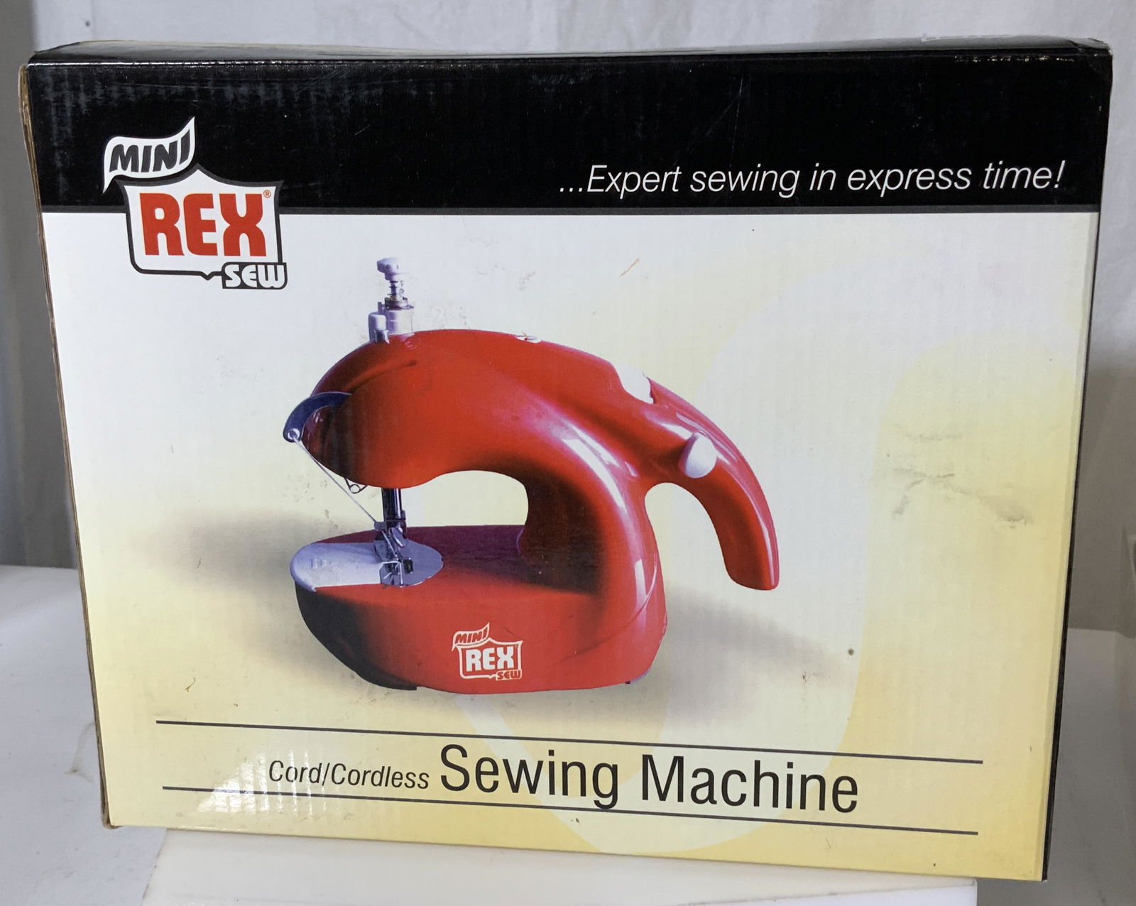 Mini Rex Cordless Sewing Machine, Org Box: Portable sewing machine, cordless, comes in original box with packaging, instruction booklet and bobbins, spindle, thread. Appears never used. Item measures app 8 in long. ( 4x 9 x 7.5 in).needs AA ba