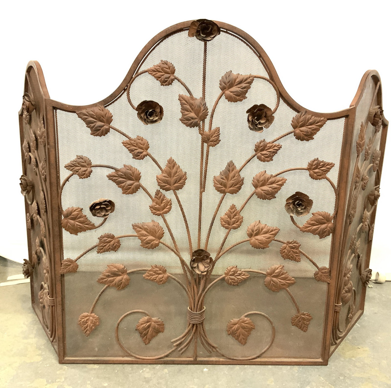 Vintage Floral & Leaf Detailed Fireplace Screen: Fireplace screen is vintage. Piece has metal floral, & leaf detailed structures. Fireplace screen is bronze toned. Piece measures approx 31 inches tall 50 inches wide. Fireplace screen, floral firepla