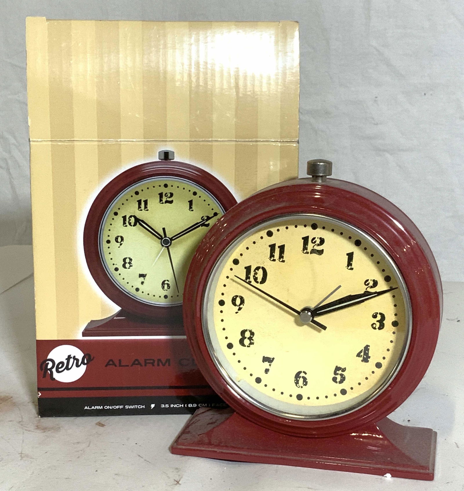 Retro style Modern Alarm Clock, Org Box: On/ off alarm, luminous hands, battery operated AA. Made to look like it’s in vintage condition, comes in original box. 5.5 in tall, 5 in wide. Property of Brooklyn Collector’s Estate Click, analo