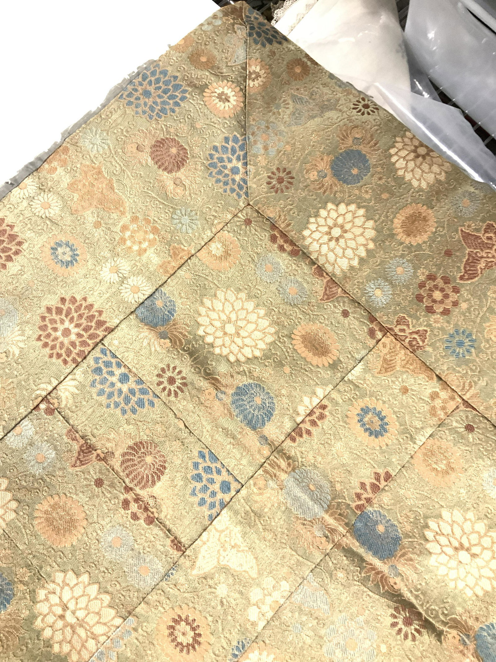 Vintage Asian Silk Brocade Hand Sewn Fabric, Japan: Handmade Japanese Brocade Fabric, possibly used as a table cover, hand sewn pieces with silk backing ( needs to be replaced). No issues with brocade. Moss green with gold, blue, rust color flowers. Me