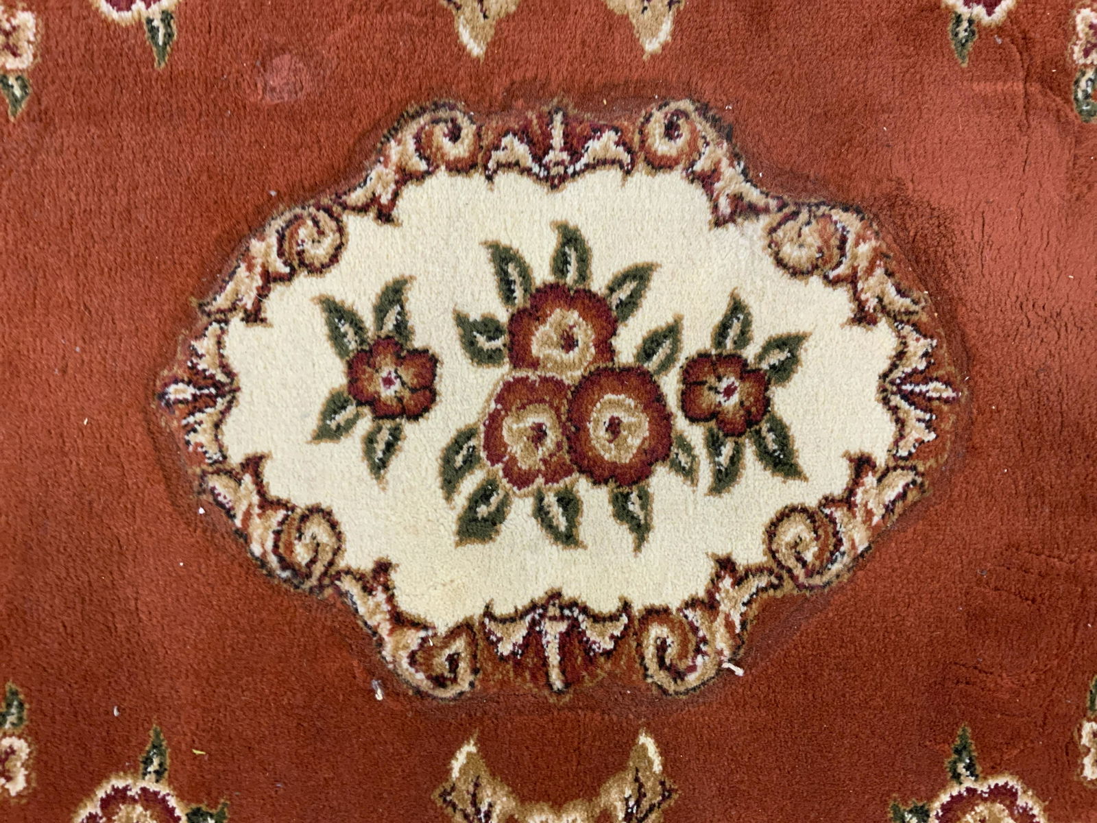 Vintage MODERN THANIA Turkish Rug: Rug is vintage. Piece is possibly handmade. Piece is decorated with multi toned floral & leaf detail. Piece measures approx 44.25 inches long 27.75 inches wide. Label on underside reads as MODERN THAN