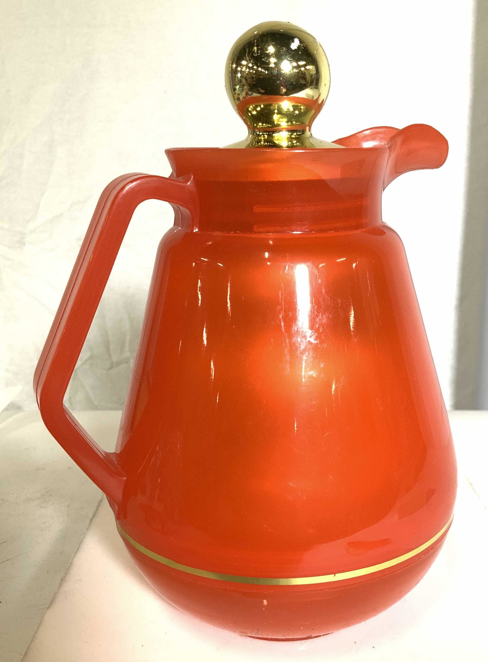 Vintage Coffee Carafe/ Hot water Insulator: Vintage coffee or hot water carafe with twist off handle, insulates hot beverage. Marked Coffee- Bottle , interior hood glass bottle. Exterior plastic composite. 9 x 7 in. Properly of Multi Generation