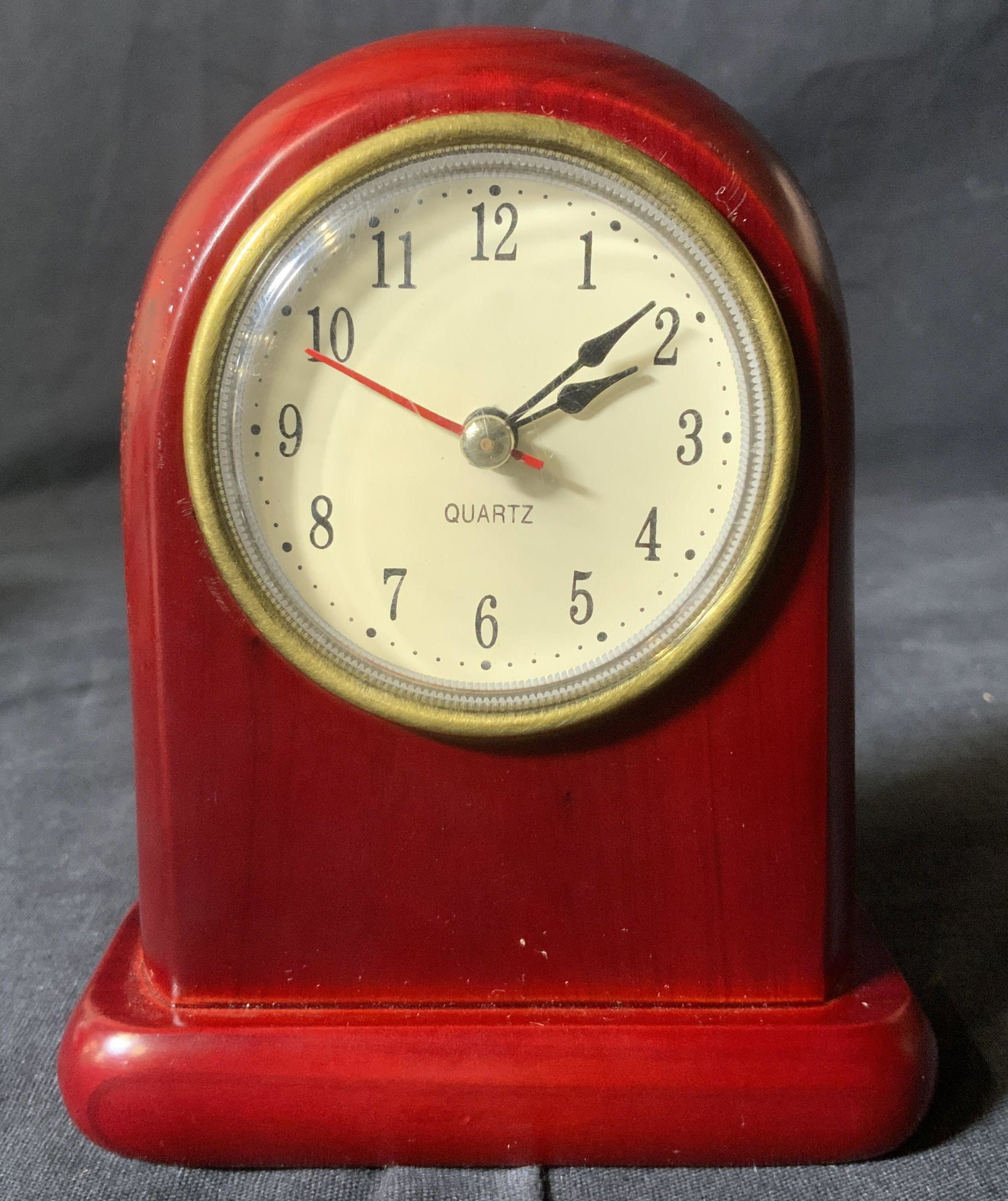 QUARTZ Wooden Desk Clock: QUARTZ Wooden Clock, not tested for functionality, inscription to piece reads ‘Quartz’ and ‘Noco Jewels’, measures 4 7/8 inches tall x 4 inches at widest point, some surface wear to piece, Pro