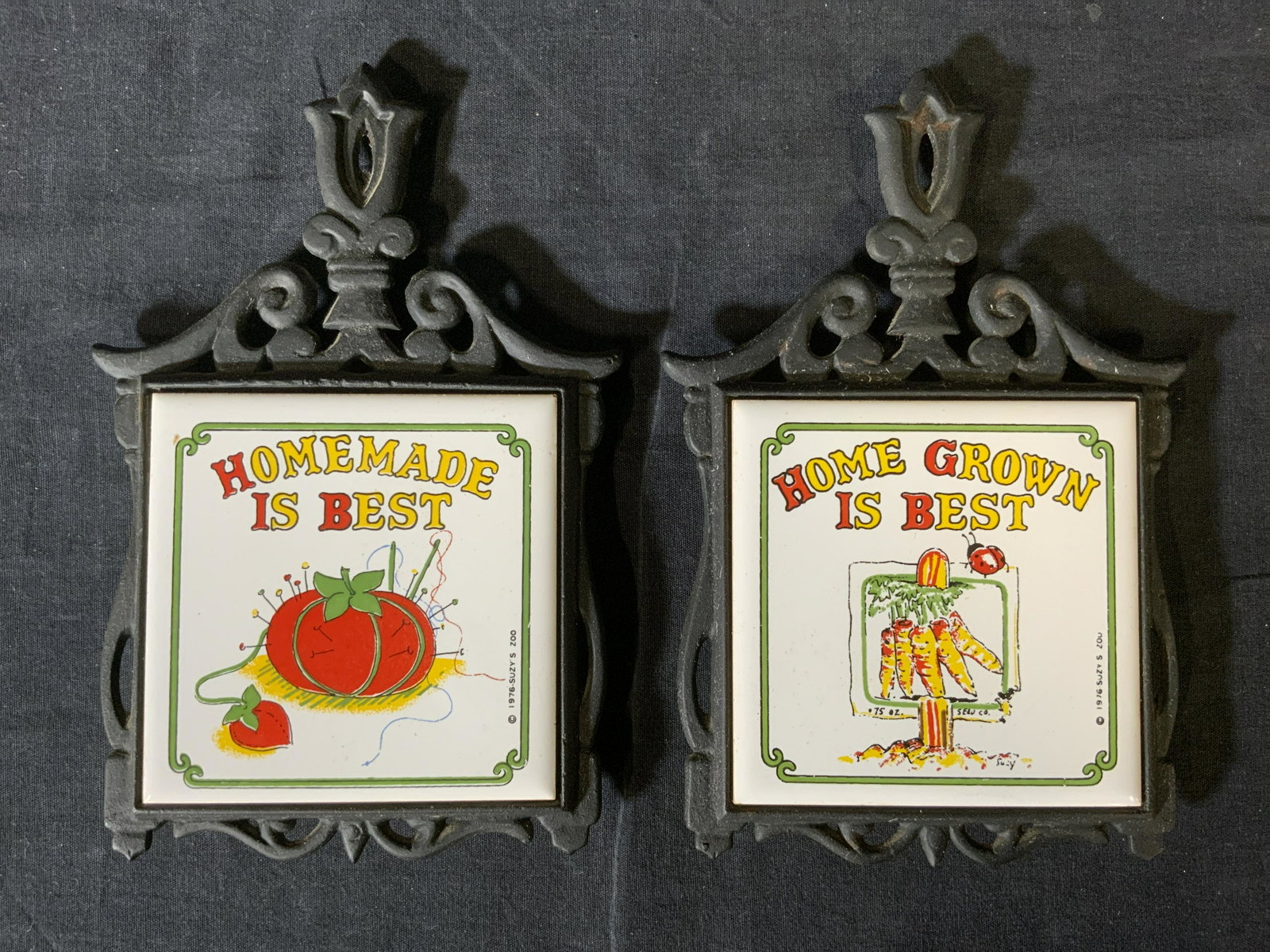 Pair Vintage KK Tile & Cast Iron Trivet, Taiwan: Pair Vintage KK Tile & Cast Iron Trivet, Taiwan, inscription reads ‘Taiwan KK’, ‘1976 Suzy’s Zoo’, inscriptions in Chinese characters, both measure 8 5/8 inches long x 5 3/4 inches at widest