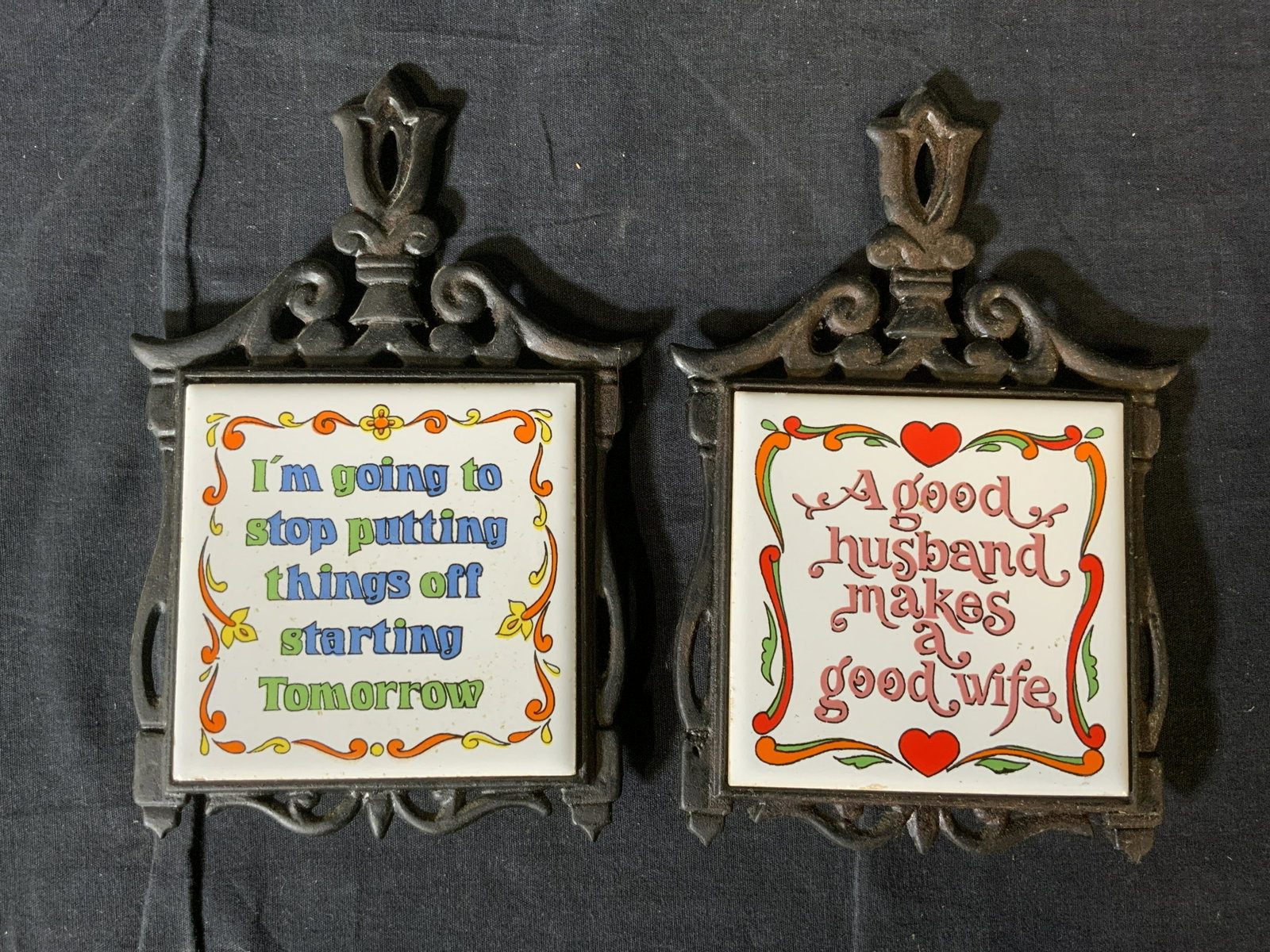 Pair Vintage SEVEN STARS Tile & Cast Iron Trivets: Pair Vintage SEVEN STARS Tile & Cast Iron Trivets, inscriptions read ‘7’, ‘T-4’, ‘3’, ‘Seven star’ ‘Taiwan’, both measure 9 x 5 7/8 inches, some rusting and surface wear to pieces,