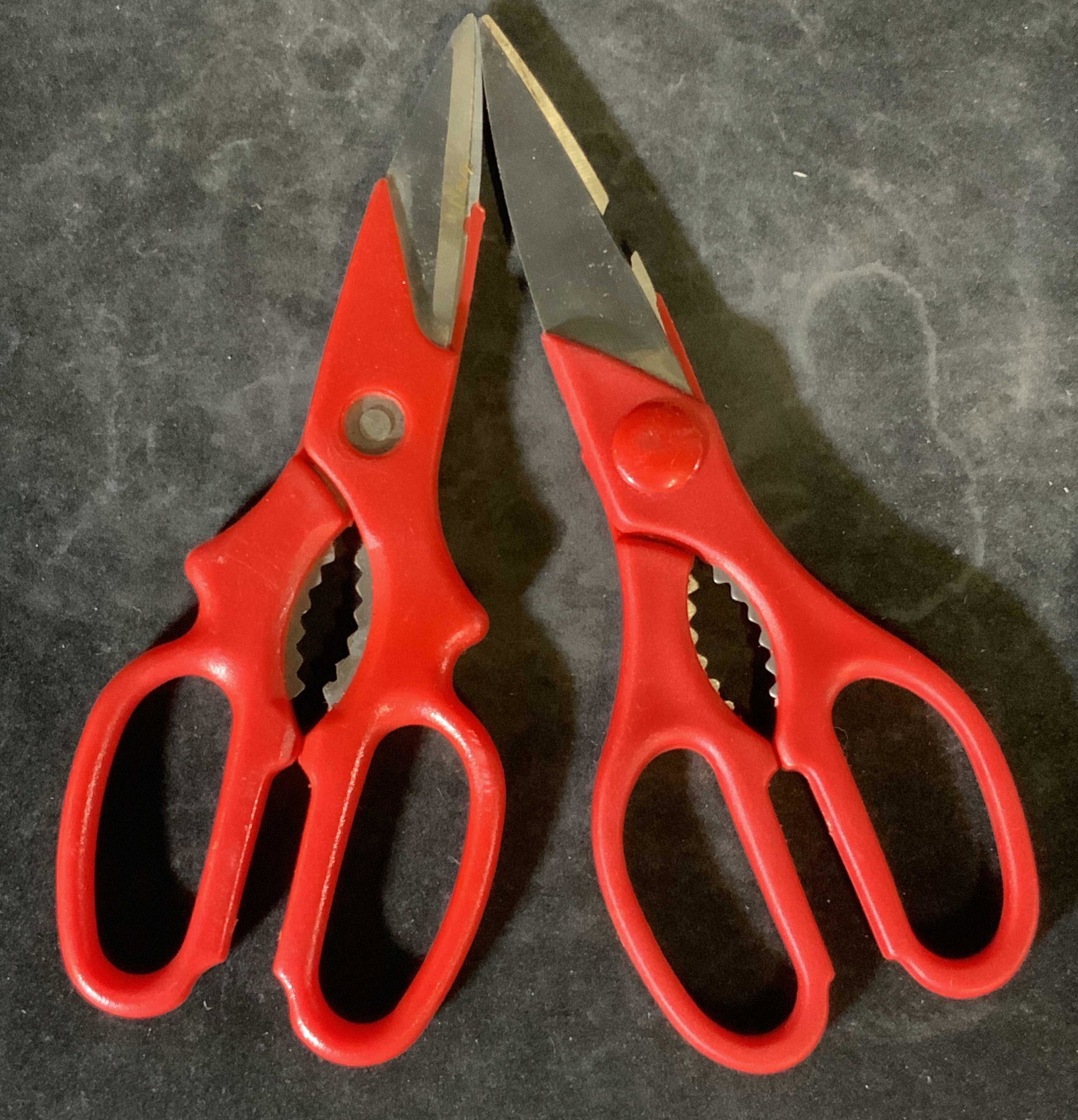 Lot 13 Red Grip Scissors: Thirteen red gripped scissors of various shapes and sizes. Some pieces are vintage, some are modern. Conditions vary. Largest Approx. 9 x 3 in. Property of multigenerational Brooklyn Collector’s Est