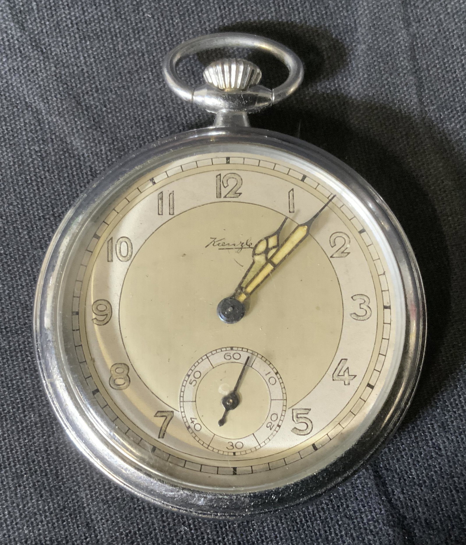 Vintage KIENZLE Pocket watch W Cloche, Germany: Vintage KIENZLE Pocket watch, Germany, inscription reads ‘Kienzle’, measures 1 7/8 inches in diameter, surface wear to piece and cloche, cloche measures 4 5/8 inches tall x 4 inches in diameter, n