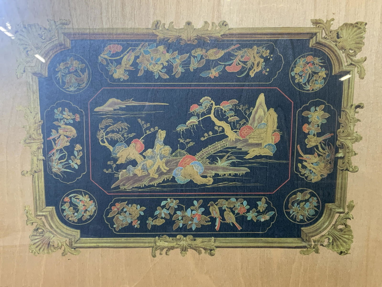 Chinese Style Offset Lithograph on Wood Panel: Chinese style offset lithograph on wood panel, text to the lower left corner in Italian reads ‘Lacca Cinese sec.XVIII’, subject a landscape of lions in a mountain like setting, marble painted wood