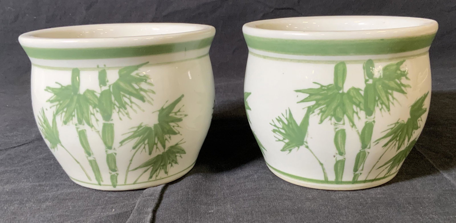 Pair Chinese Planters with Bamboo Motifs: Pair Chinese Planters with Bamboo Motifs, inscriptions read ‘26 oz Made in China’, both measure 4 inches tall x 5 inches in diameter, some surface wear to pieces, Property of multi generation Broo