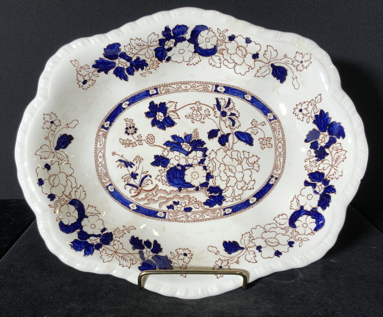 MASON’S English Ironstone Scalloped Dish, Mandarin: Hand painted white ironstone scalloped dish with a hand painted floral design. Primarily white, blue, and earthy red hues. Embossed ironstone accents along rim. The design pattern name is MANDARIN. Th
