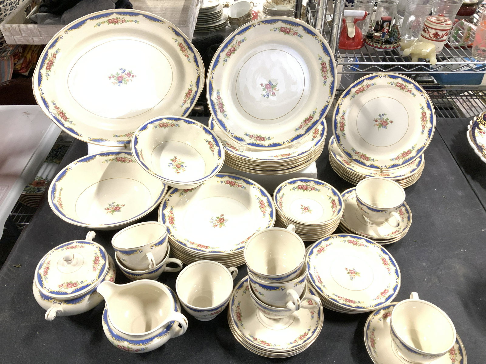 EGGSHELL NAUTILUS Dinnerware China Set 59: Beige porcelain dinner ware set with dainty colorful roses and flower pattern, blue Victorian border , gilt rim. Pieces are Hallmarked EGGSHELL NAUTILUS USA L 42 N 5 and A 43 N 5. 1 serving platter, 8