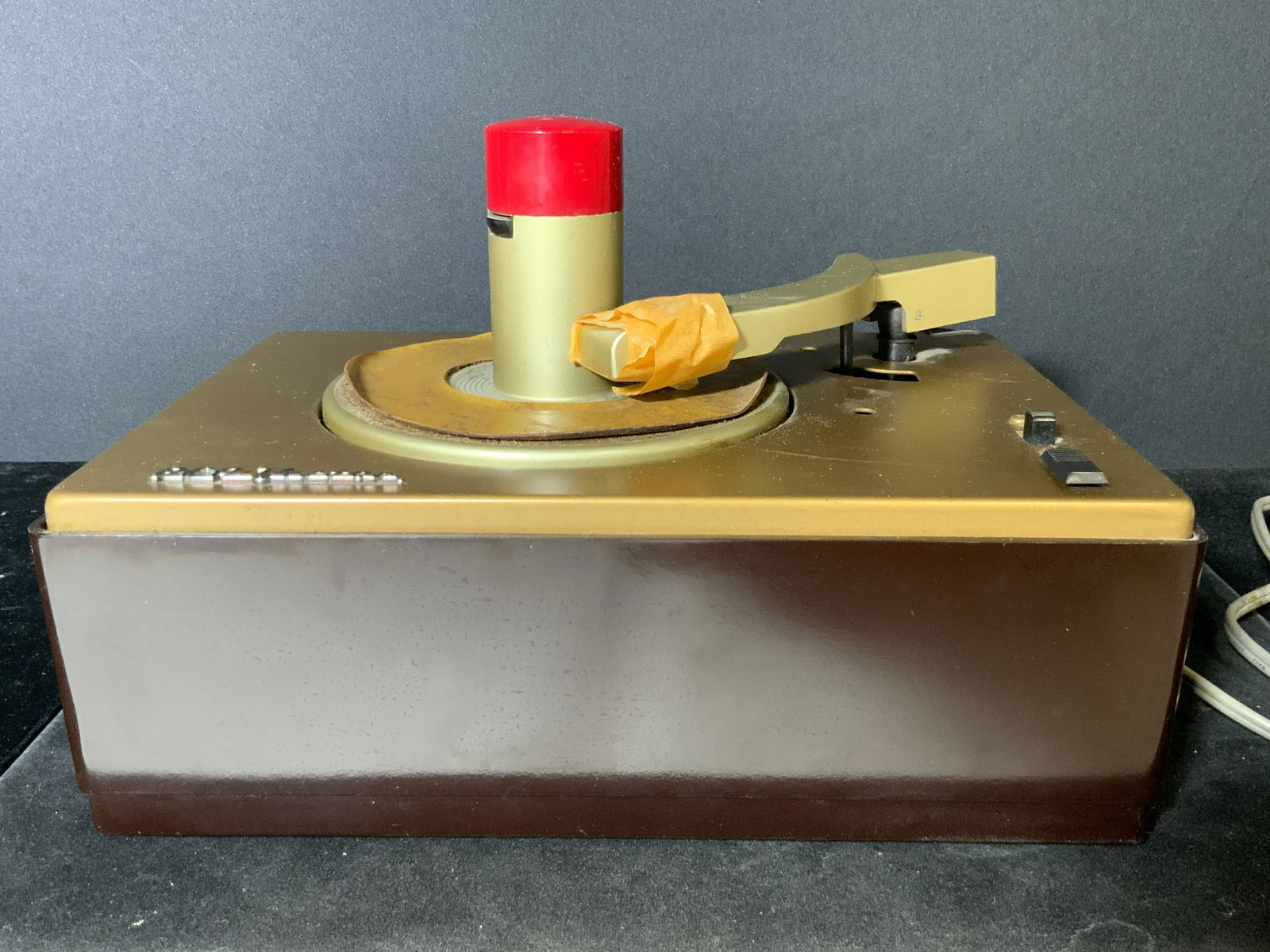 Collectible Vintage RCA VICTOR 45 Record Player: A collectible vintage, circa 1950 - 1960s, RCA VICTOR record player. Model 45-J-2. This piece was crafted to play size 45 records. Piece is not tested for working condition. Underside still has origin