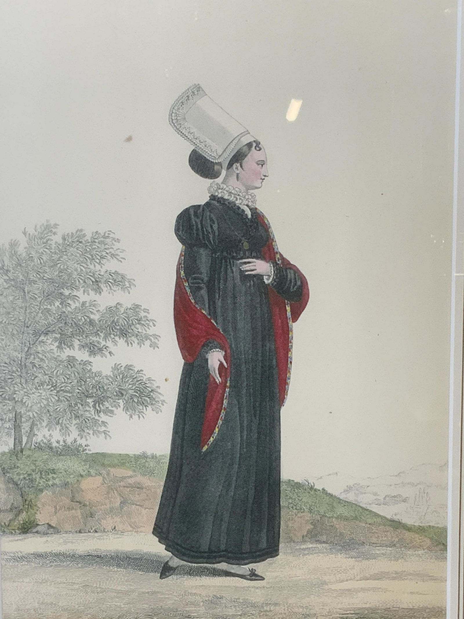 Lithograph of Renaissance Woman in Garden: Lithograph of Renaissance woman in garden, no apparent inscriptions or markings, subject a woman in Renaissance attire with tall bonnet standing in a garden, white matting with border lines printed, g