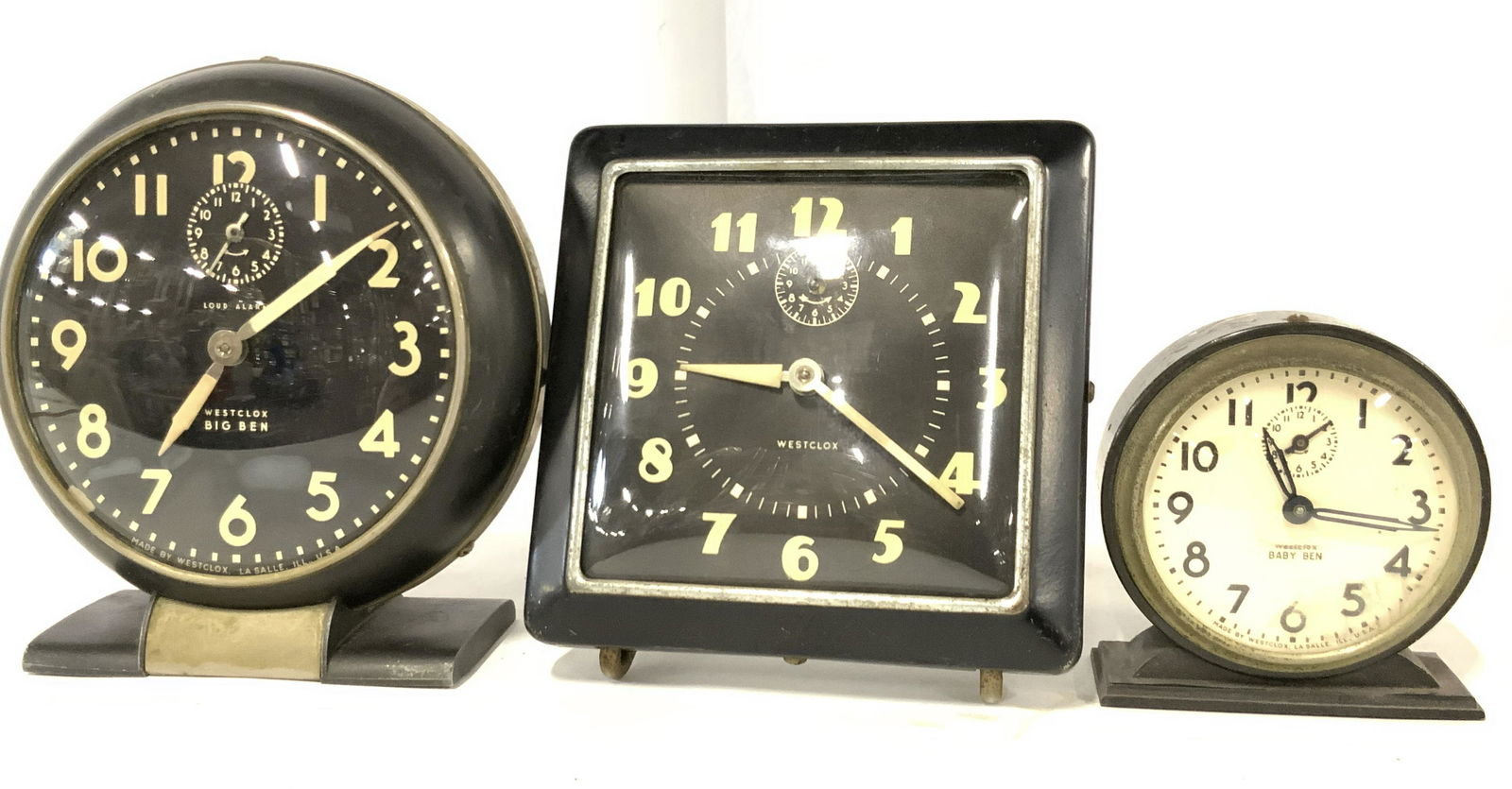 Lot 3 Vintage WESTCLOX Tabletop Clocks: Three collectible vintage tabletop clocks. All clocks are signed WESTCLOX. Brand name appears on the clock faces. Two clocks are square in form, one is circular. The two circular clocks are named BIG